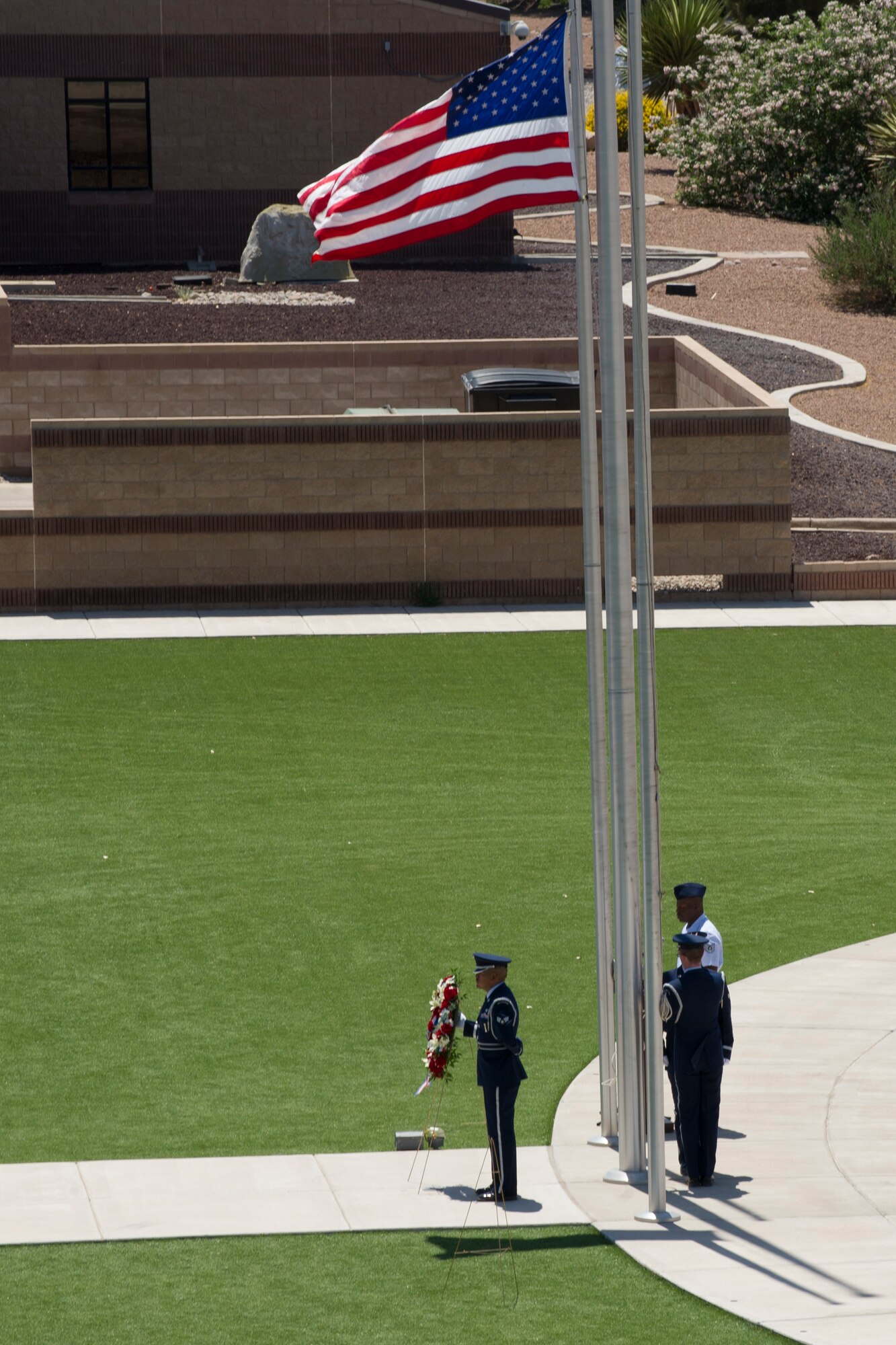 Members of the Steel Talons Honor Guard raise a U.S. Flag during a Memorial Day ceremony at Holloman Air Force Base N.M., May 23. Formerly known as Decoration Day, it originated after the American Civil War to commemorate the Union and Confederate soldiers who died in the Civil War. (U.S. Air Force photo by Senior Airman Joshua Turner)