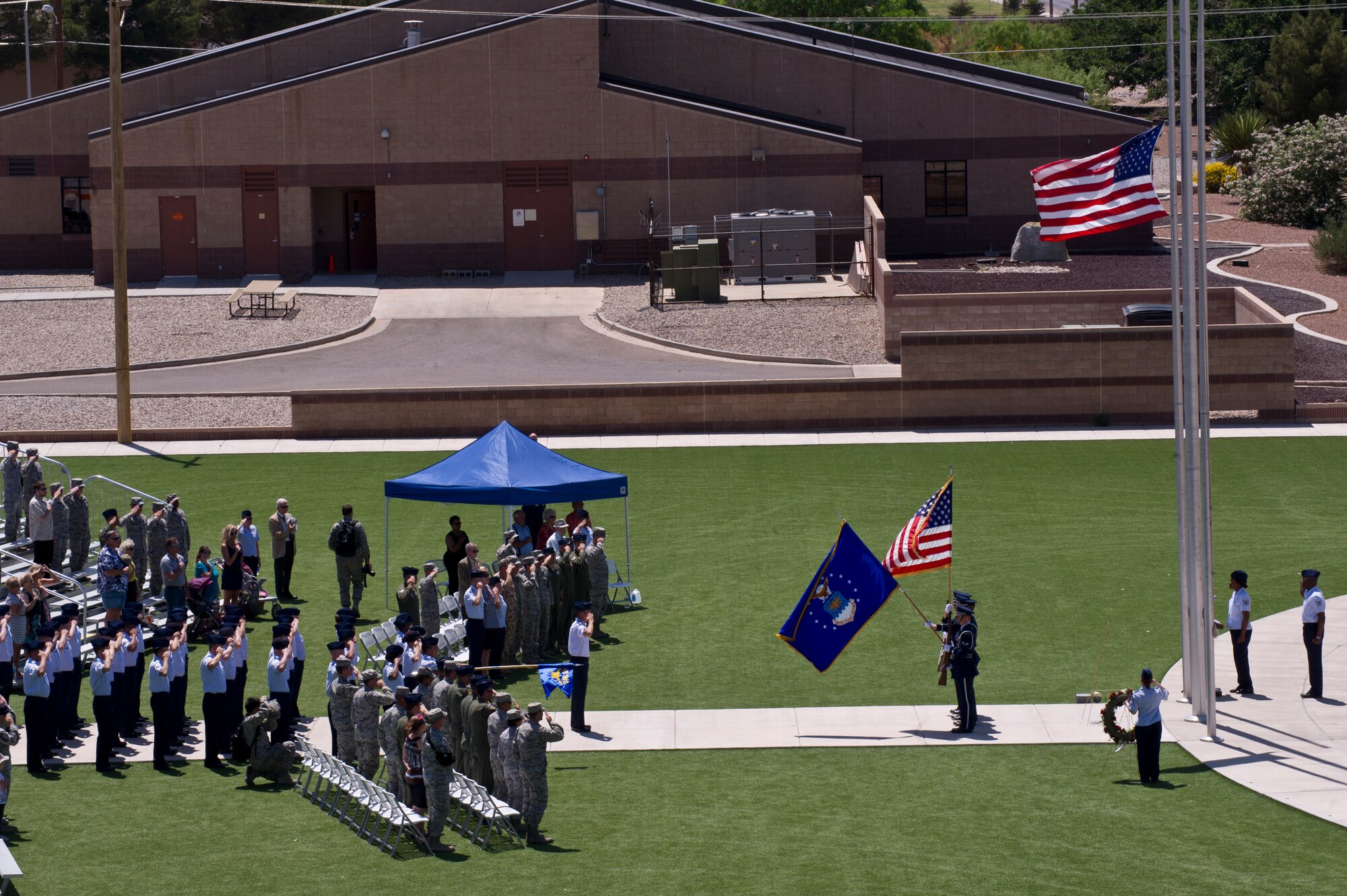 Members of Team Holloman pay tribute to fallen comrades during a Memorial Day ceremony at Holloman Air Force Base, N.M., May 23. Formerly known as Decoration Day, it originated after the American Civil War to commemorate the Union and Confederate soldiers who died in the Civil War. (U.S. Air Force photo by Senior Airman Joshua Turner/Released)