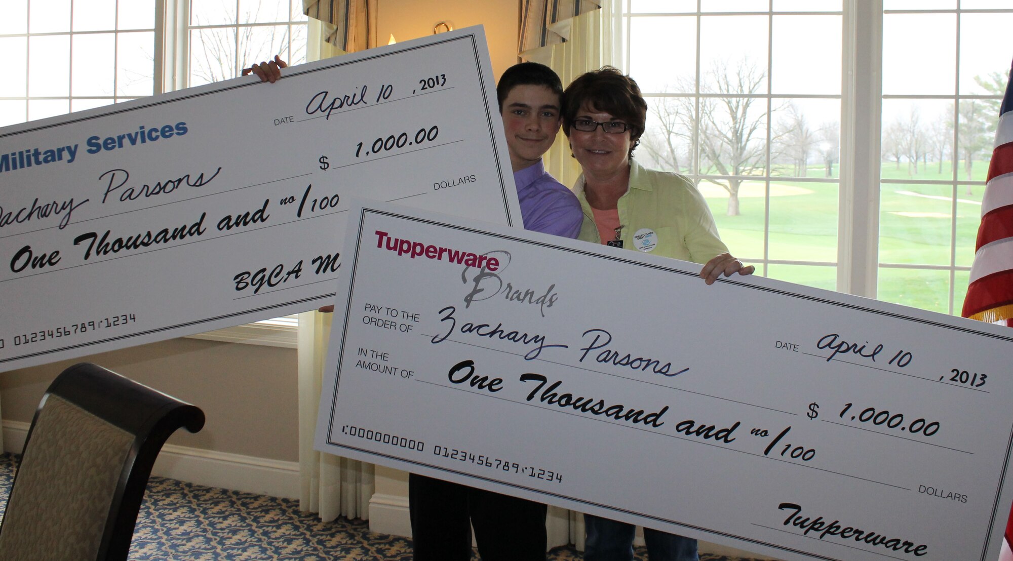 Zachary Parsons, Missouri Military Youth of the Year, poses with his mother, Debbie Parsons, April 10, 2013, after being presented his winnings in Jefferson County, Mo. The Youth of the Year award recognizes outstanding contributions to a member’s family, school, community and teen center, as well as success overcoming personal challenges and obstacles. (Courtesy photo by Kimberly O’Brien/Released)