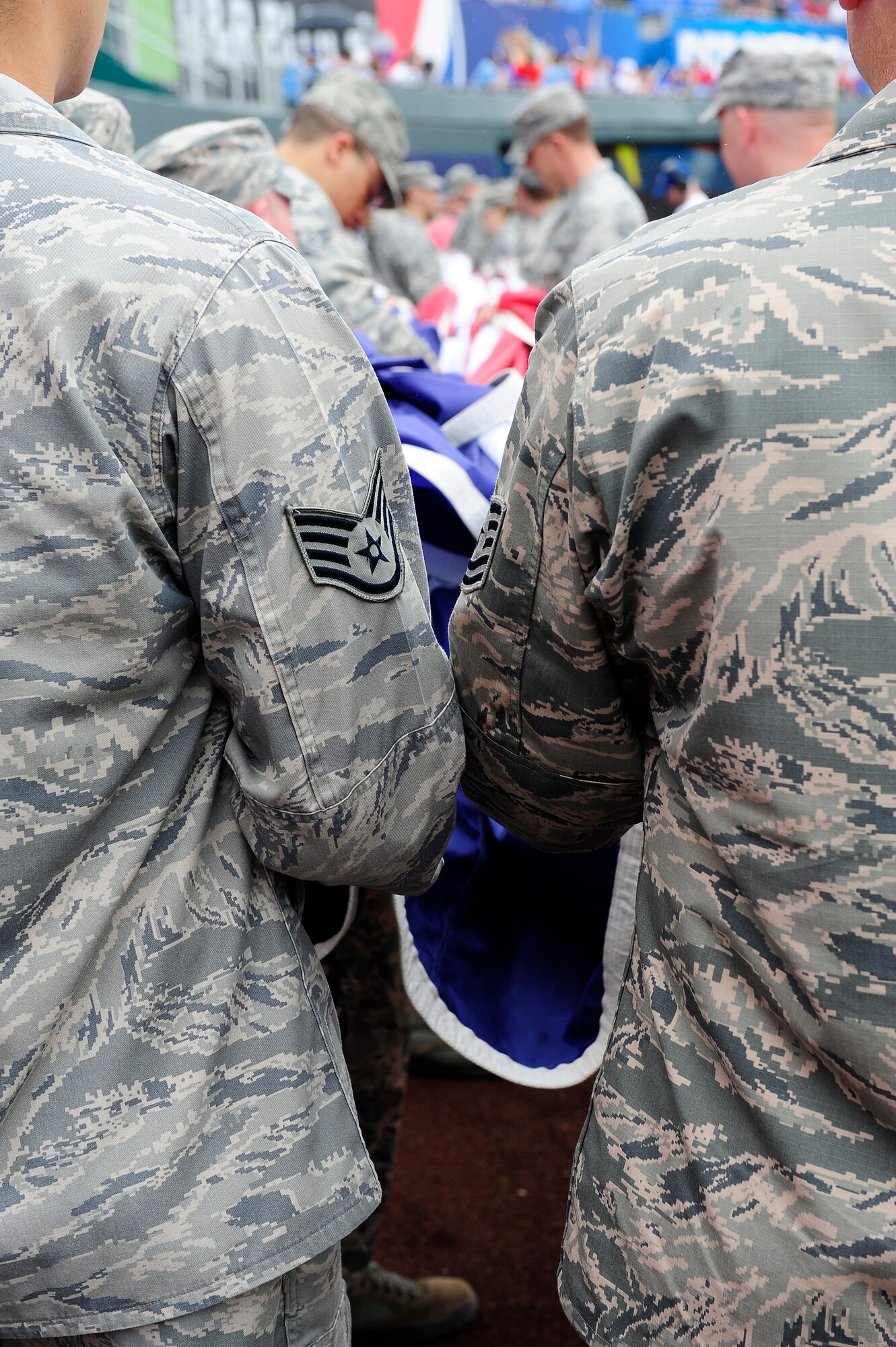 Thirty Airmen from Whiteman Air Force Base, Mo., prepare to display the American flag during the Kansas City Royals’ Armed Forces Day game against the St. Louis Cardinals game, May 27, 2013, at Kauffman Stadium in Kansas City, Mo. The special pregame ceremony included recognition of veterans, wounded warriors and a military family, as well as a tribute to fallen Soldiers and World War II veterans. (U.S. Air Force photo by Airman 1st Class Shelby Orozco/Released)