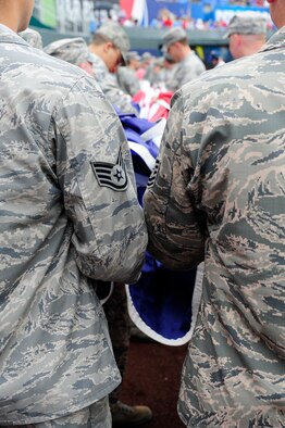 Thirty Airmen from Whiteman Air Force Base, Mo., prepare to display the American flag during the Kansas City Royals’ Armed Forces Day game against the St. Louis Cardinals game, May 27, 2013, at Kauffman Stadium in Kansas City, Mo. The special pregame ceremony included recognition of veterans, wounded warriors and a military family, as well as a tribute to fallen Soldiers and World War II veterans. (U.S. Air Force photo by Airman 1st Class Shelby Orozco/Released)