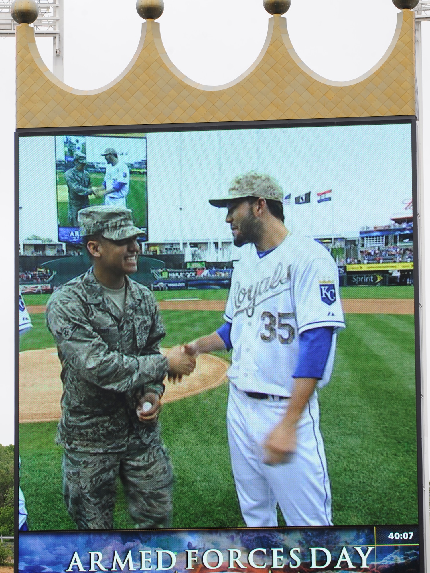 Airman Eric Sadsad of the 509th Force Support Squadron is given a baseball by Kansas City Royals first baseman Eric Hosmer prior to the start of the Royals’ Armed Forces Day game against the St. Louis Cardinals, May 27, 2013 at Kauffman Stadium in Kansas City, Mo. A special pregame ceremony honored Service men and women, and included  recognition of veterans, wounded warriors and a military family. (U.S. Air Force photo by Staff Sgt. Alexandra M. Boutte/Released)