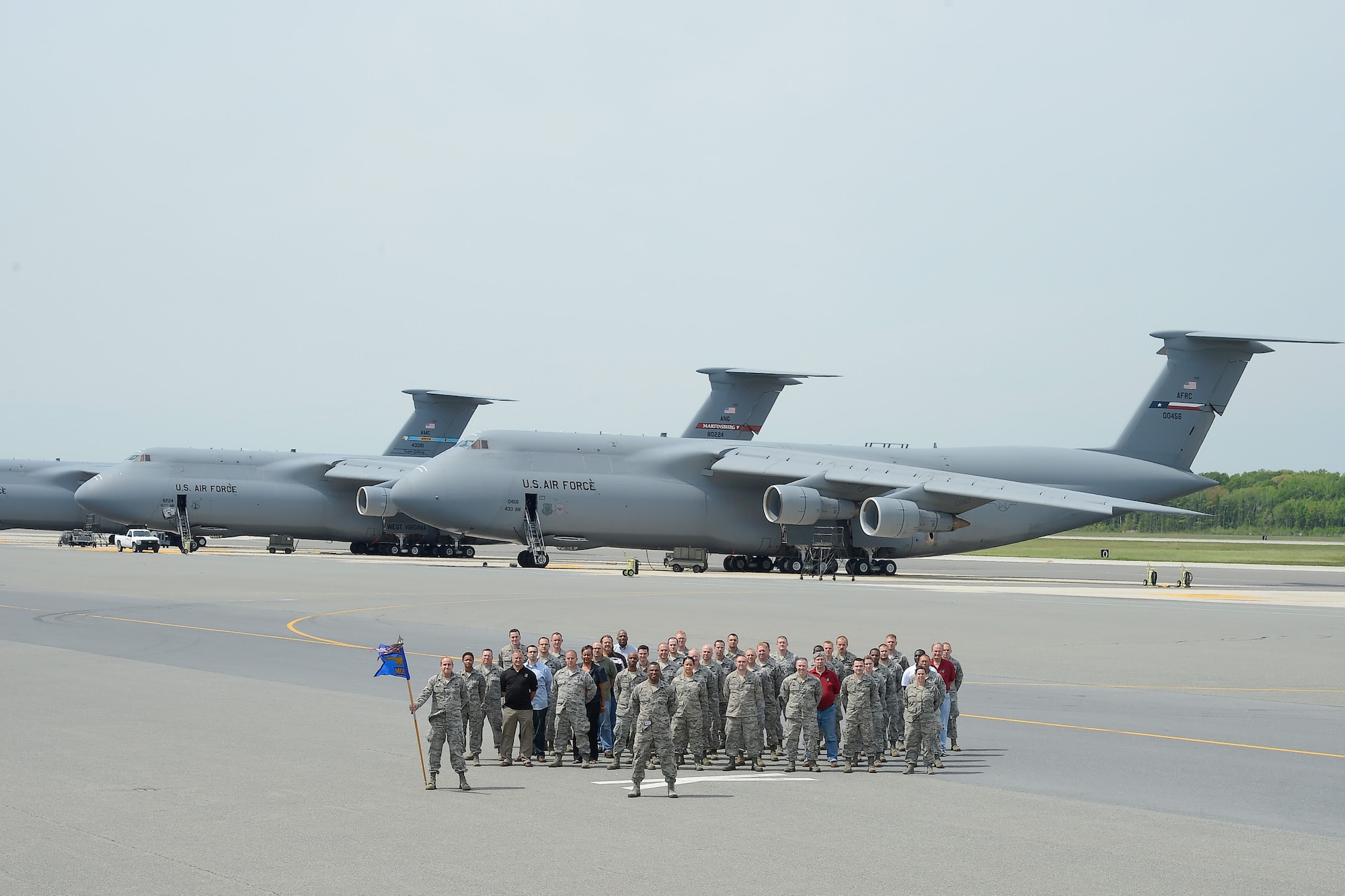 Members of the 436th Maintenance Operations Squadron pose for a squadron photo May 10, 2013, on the flightline at Dover Air Force Base, Del. The 436th MOS will officially stand down in a ceremony June 3, at the Air Mobility Command Museum. (U.S. Air Force photo/Greg L. Davis)