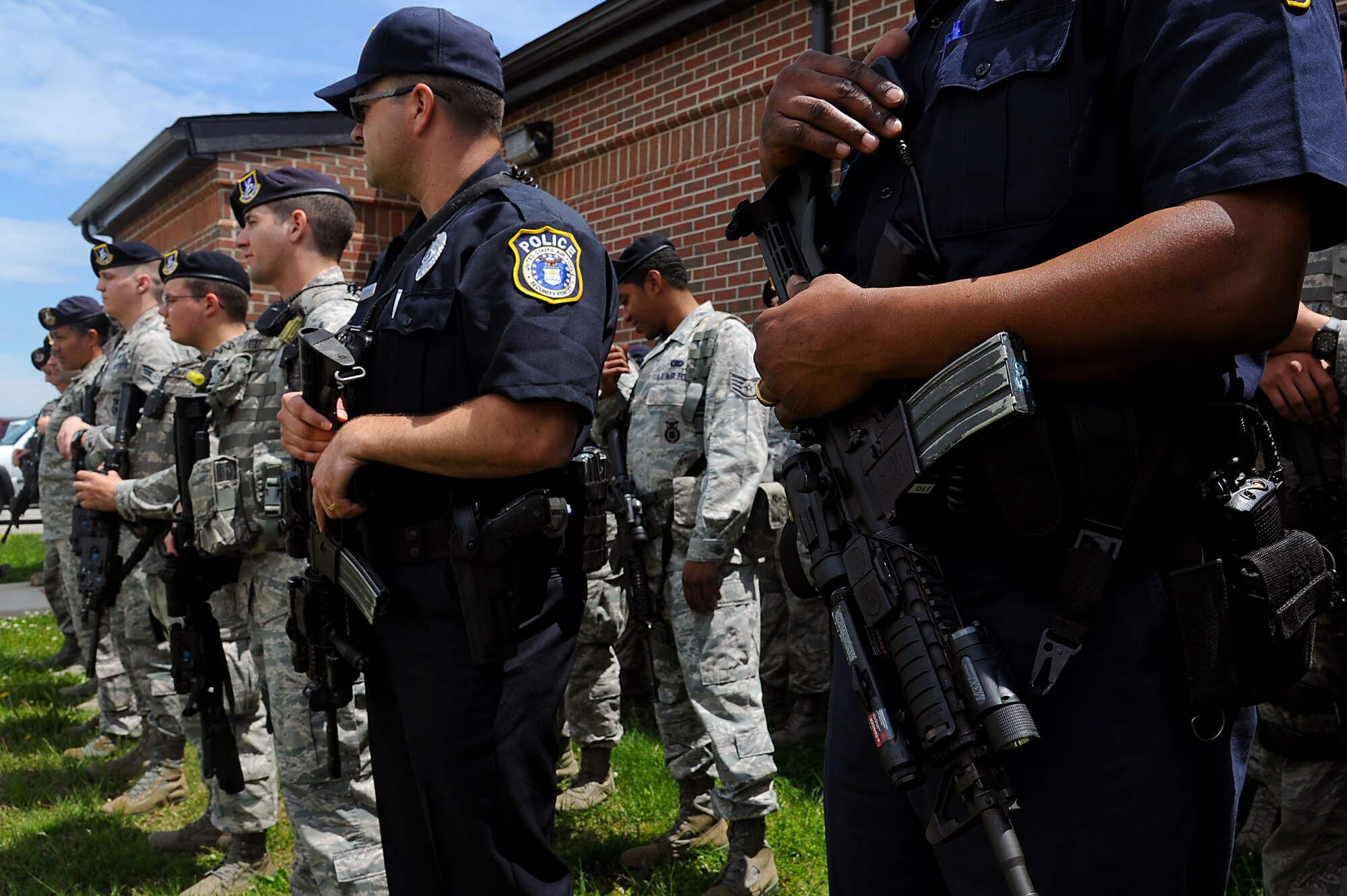 633rd Security Forces Squadron personnel receive a briefing during training as part of the Eagle Eyes program at Langley Air Force Base, Va., May 8, 2013. The 633rd SFS and the Air Force Office of Special Investigations train and devote time and effort to programs that ensure Service members have the tools to protect the base from any threat. (U.S. Air Force photo by Airman 1st Class Victoria H. Taylor/Released)