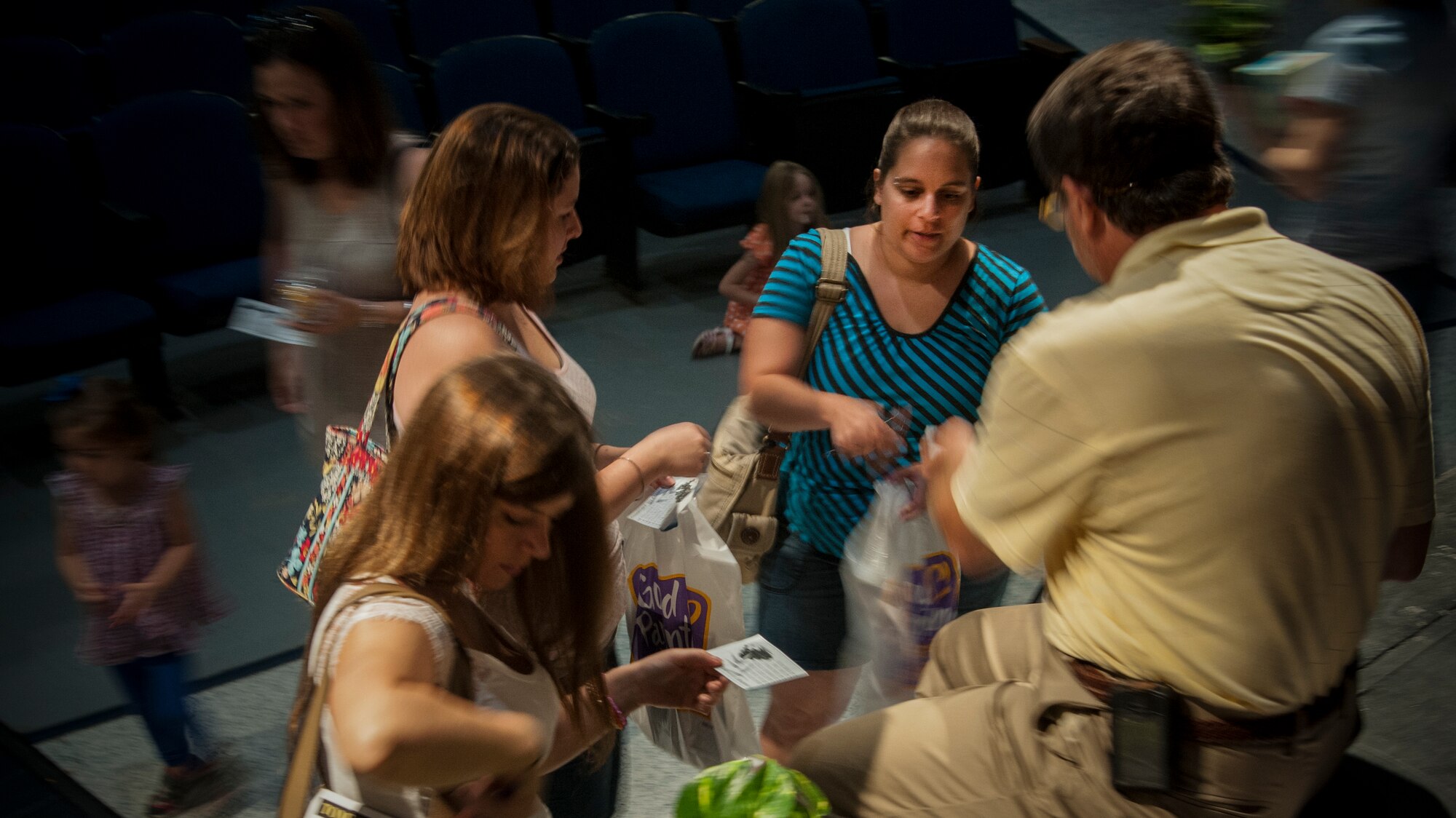 Military spouses hand in information in order to take a horticulture class offered at Wiregrass Georgia Technical College, May 22, 2013. The women turned in the information after receiving a gardening lesson at the Pamper and Applaud Military Spouse Appreciation event at Moody Air Force Base, Ga. (U.S. Air Force photo by Airman 1st Class Sandra Marrero/Released)
