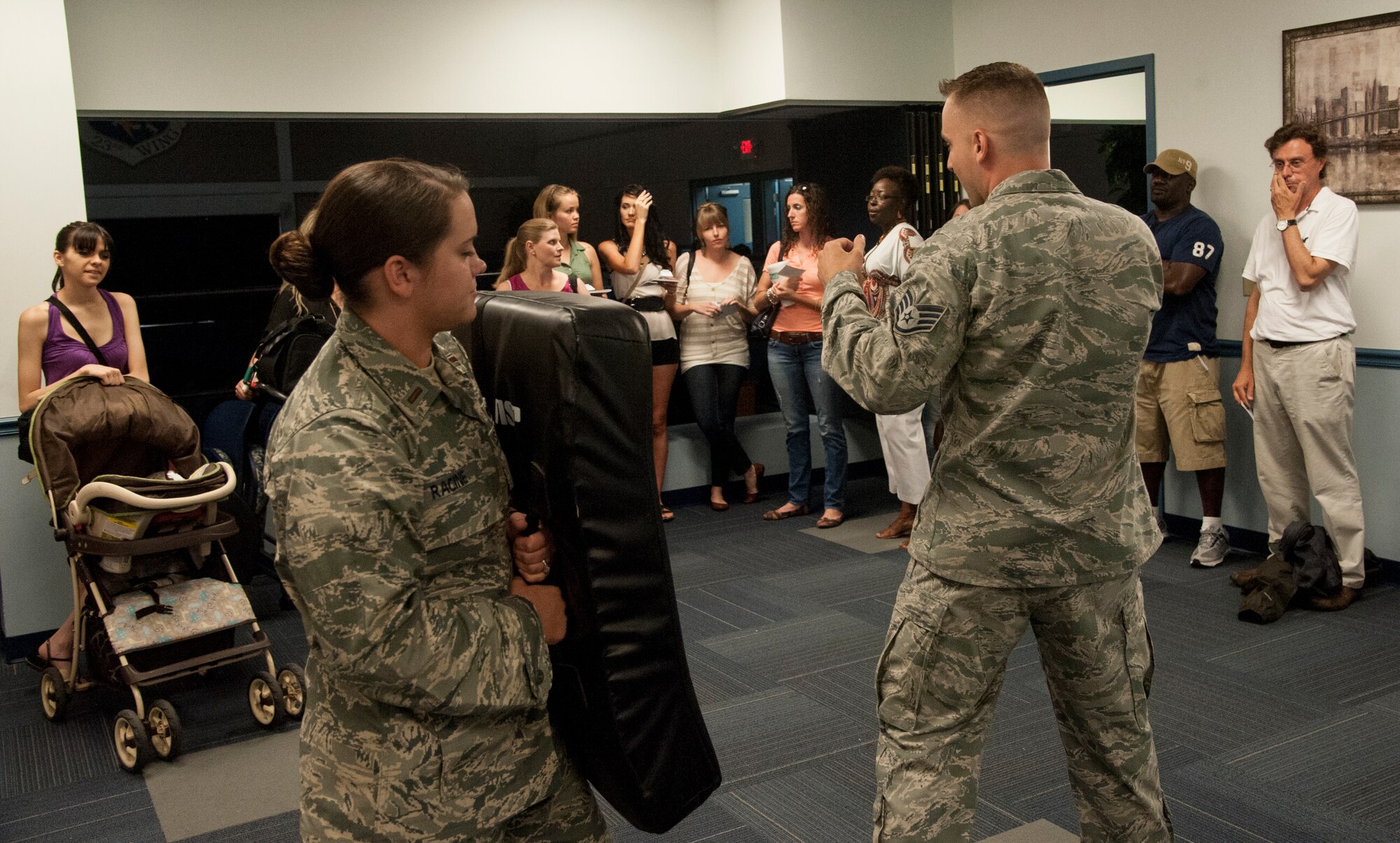 U.S. Air Force Staff Sgt. Joseph Overholt, 23d Security Forces unit training manager, teaches military spouses self-defense techniques May 22, 2013, at Moody Air Force Base, Ga. The women had the opportunity to perform fighting and evasion techniques. (U.S. Air Force photo by Airman 1st Class Sandra Marrero/Released)
