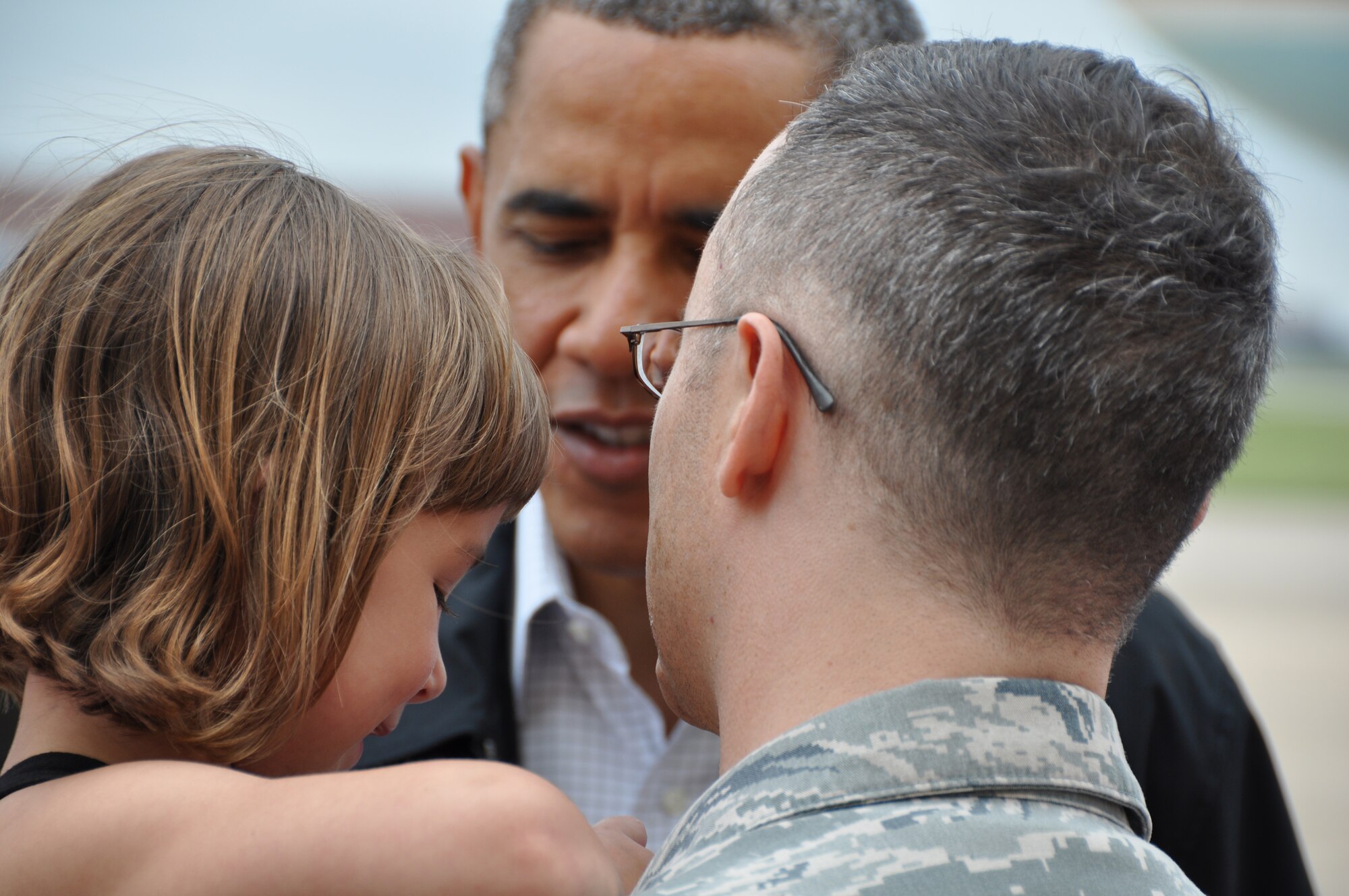 TINKER AIR FORCE BASE, Okla.--President Barack Obama greets Capt. Russell
Ramsey and the family affected by the tornado here, May 26. Team Tinker members effected by the EF-5 Tornado that hit Moore Okla. and first responders, met with the president on the flight line before he traveled to Moore to see the devastation first hand.  (U.S. Air Force Photo by Maj. Jon Quinlan)
