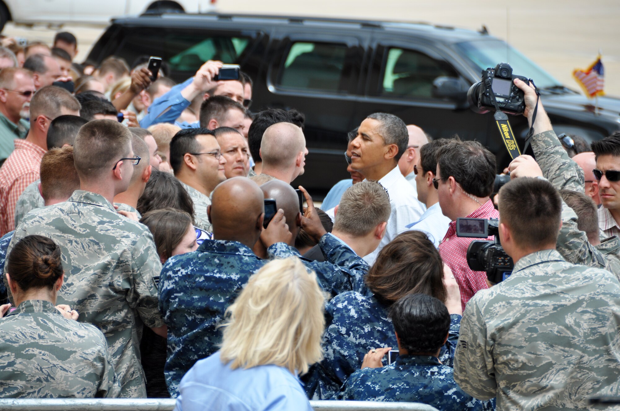 President Barack Obama exchanges kind words and listens to stories from Airmen at Tinker Air Force Base who either lost or had severely damaged homes after a devastating tornado wiped out several communities recently.  The president surveyed the area with Oklahoma Governor Mary Fallin on Sunday, May 26, 2013.  (U.S. Air Force Photo by Senior Airman Mark Hybers)