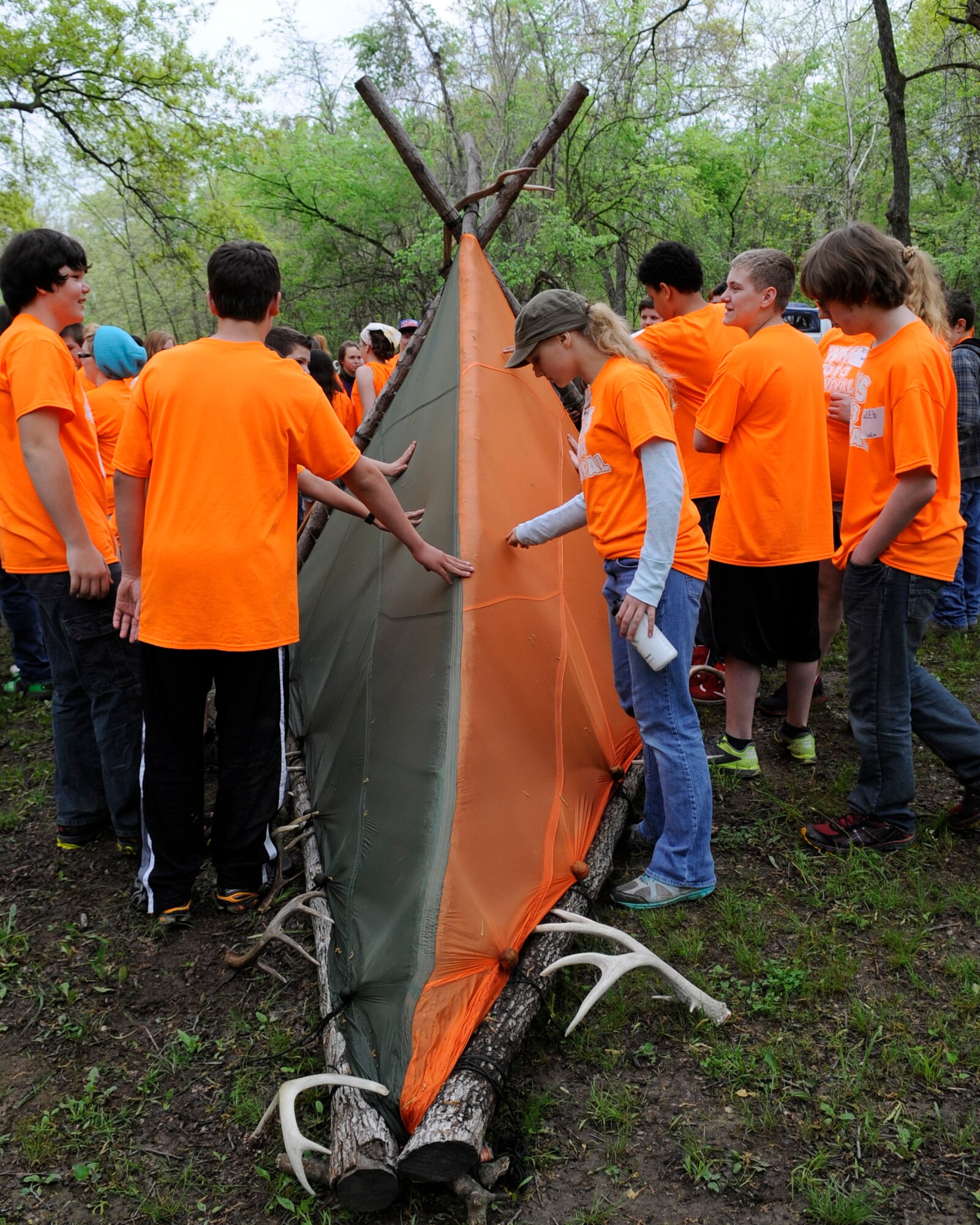 Warrensburg Middle School seventh-graders participated in a survival day with survival, evasion, resistance and escape (SERE) specialists in Knob Noster State Park, Mo., May 10, 2013. SERE instructors demonstrated how to build proper and stable structures during a survival situation and how to efficiently start a fire. (U.S. Air Force photo by Staff Sgt. Alexandra M. Boutte/Released)