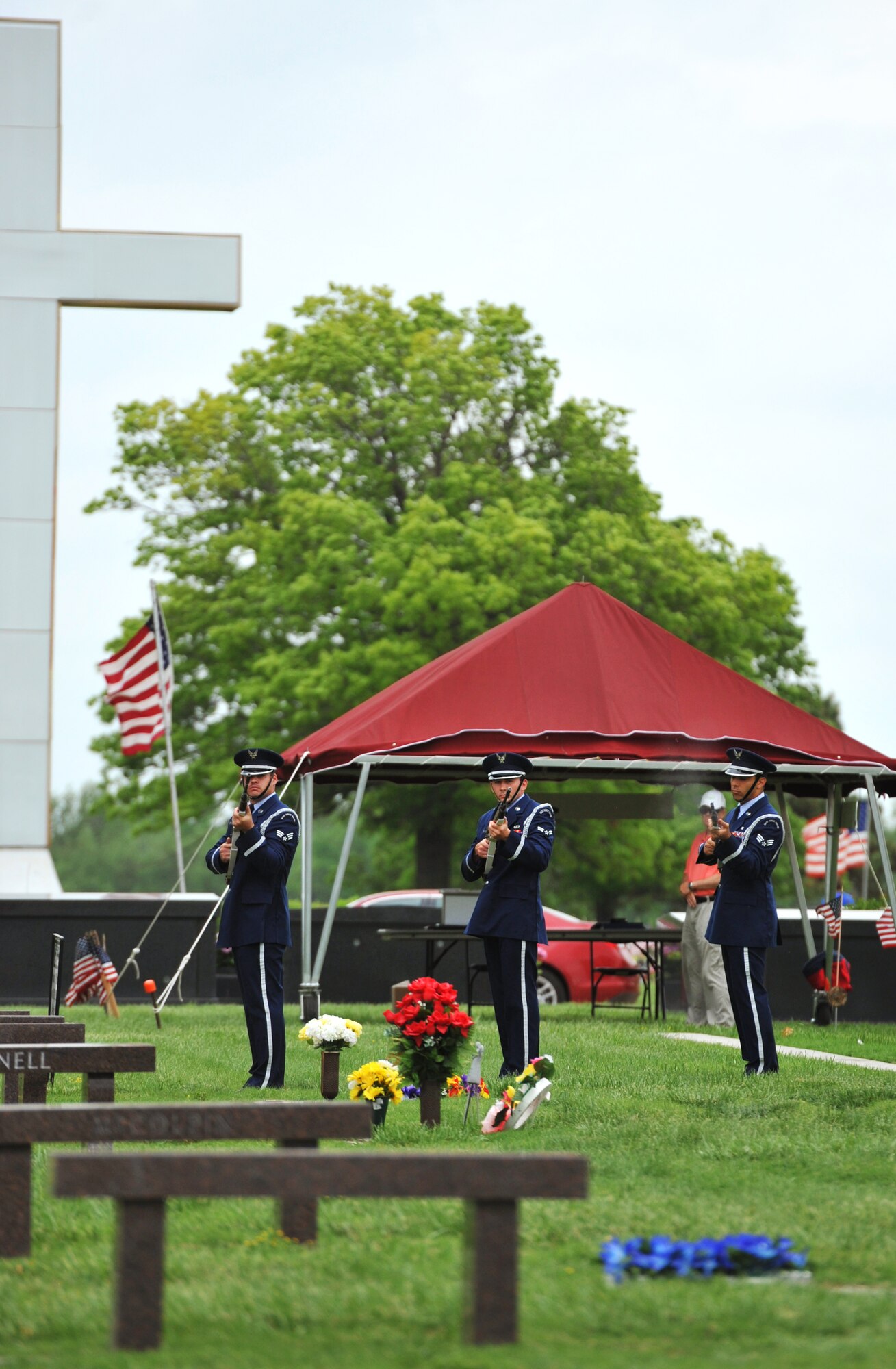 Senior Airman Blaise Ruff, Airman 1st Class Christopher Frerichs and Senior Airman Joshua Martin, 22nd Air Refueling Wing Honor Guard members, McConnell Air Force Base, Kan., perform a rifle sequence commonly known as the seven-gun, three-volley salute at the 55th Annual Memorial Day observance May 27, 2013, at Resthaven Mortuary and Cemetery, Wichita, Kan. (U.S. Air Force photo/Staff Sgt. Jess Lockoski)