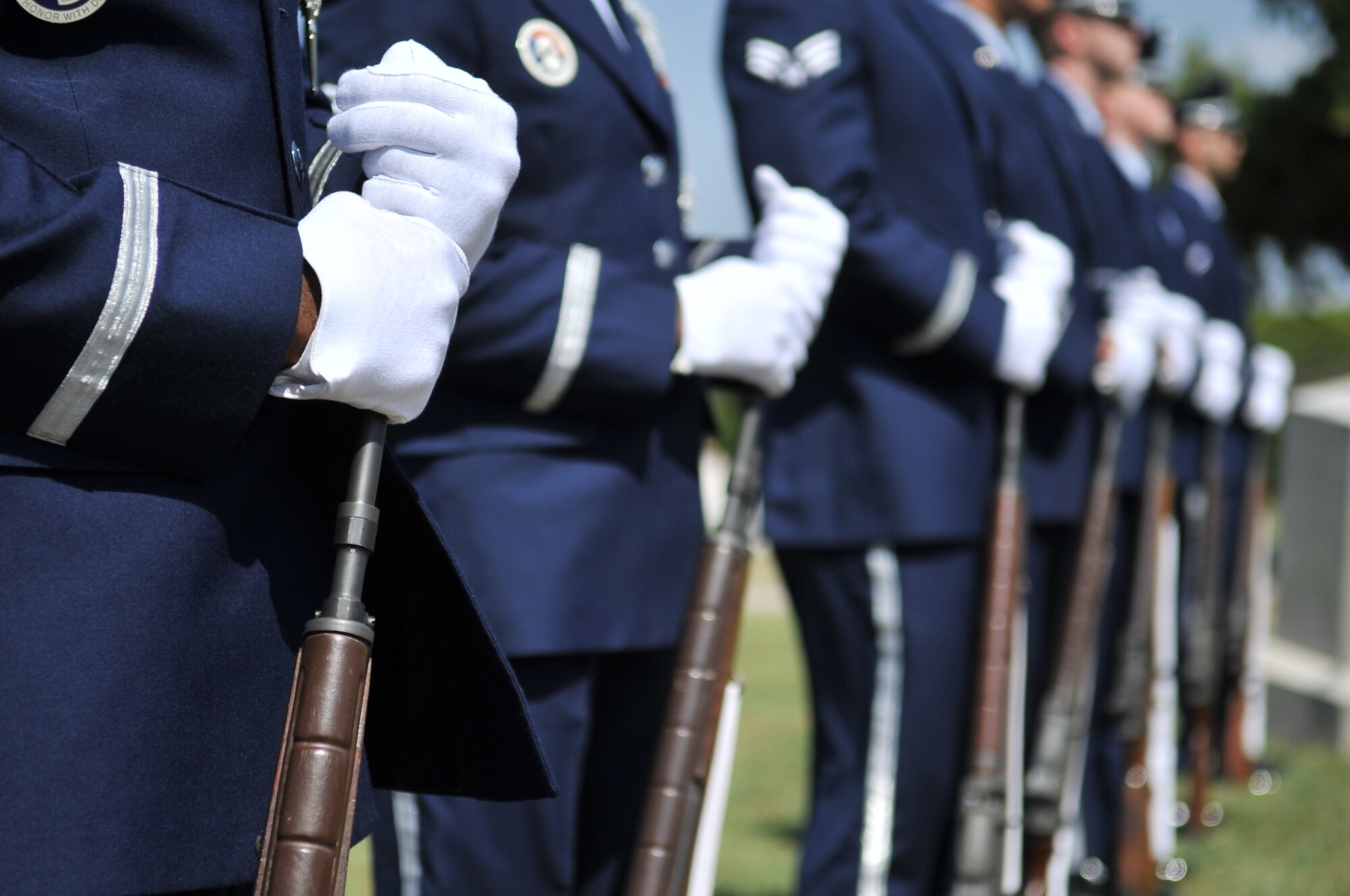 ALTUS, Okla. – Altus Air Force Base Blue Knights honor guard members stand in a 21-gun salute formation during a Memorial Day ceremony at the Veterans Garden Memorial Cemetery, May 27. The Blue Knights volunteered as a nine-man detail to perform a 21-gun salute and a bugler perform during the ceremony. (U.S. Air Force photo by Senior Airman Dillon Davis/Released) 