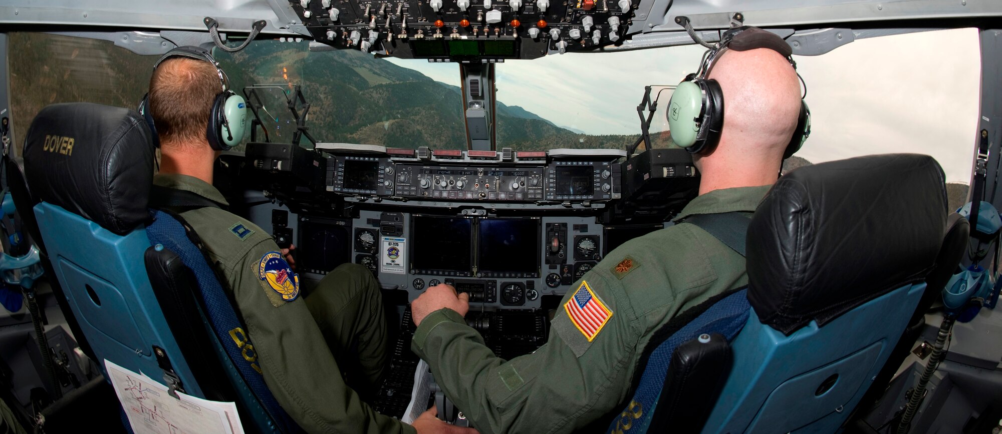Pilot Maj.Eric Kut, 3rd Airlift Squadron assistant director of operations, and co-pilot Capt. James Arnold, 3rd Airlift Squadron scheduler, on a C-17 Globemaster III in a hard left maneuver as part of training May 18, 2013. Starting at Dover Air Force Base, Del., training was planned to simulate high altitude airfields common in Afghanistan to help neutralize the mishaps that have happen in recent years. (U.S. Air Force photo/Senior Airman Jared Duhon)