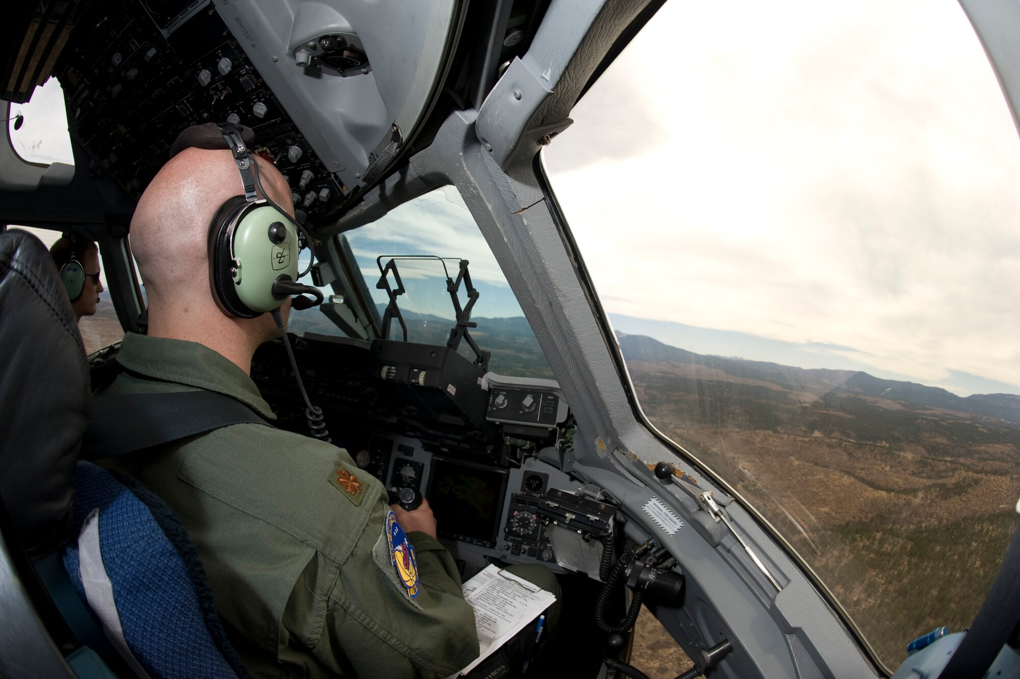 Maj. Eric Kut, 3rd Airlift Squadron assistant director of operations, piloting a C-17 Globemaster III towards the fly-away tactics training starting point May 18, 2013. Starting at Dover Air Force Base, Del., training was planned to simulate high altitude airfields common in Afghanistan to help neutralize the mishaps that have happened in recent years. (U.S. Air Force photo/Senior Airman Jared Duhon)