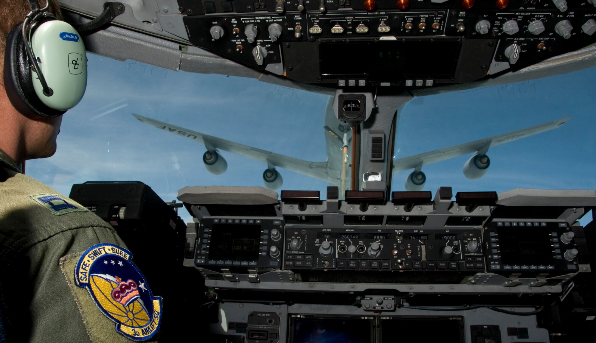 Capt. James Arnold, 3rd Airlift Squadron pilot, steadies the C-17 Globemaster III in preparation for aerial refueling with a KC-135 Stratotanker from the 127th Air Refueling Group Selfridge Air National Guard Mich., May 17, 2013 over Colorado. After departing Dover Air Force Base, Del., refueling took place in preparation for fly-away tactics trainer being conducted in Colorado. (U.S. Air Force photo/Senior Airman Jared Duhon)