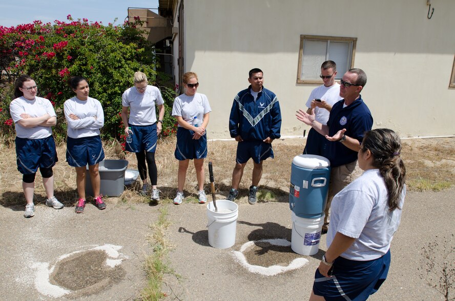 An instructor with the Texas A&M Engineering Extension Service teaches U.S. Airmen assigned to the California and Missouri National Guard’s Homeland Response Force (HRF) how to contain a hazardous materials spill during a training exercise at Naval Base Coronado, Calif., May 21, 2013. More than 100 Airmen from the Missouri and California National Guard’s HRF received emergency response training on natural disasters and domestic terrorist attacks. (U.S. Air National Guard photo by Tech. Sgt. Michael Crane/Released)