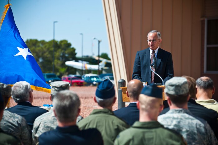 Michael Zettler, F-35 Sustainment at Lockheed Martin vice president, speaks at the ribbon cutting ceremony for the new F-35 simulator building May 23, 2013, at Nellis Air Force Base, Nev. Col. Barry Conrish, 99th Air Base Wing commander; Ray Haj, vice president and division manager of Swinerton Builders’ Government Division; Zettler; Maj. Gen. Jeffrey Lofgren, U.S. Air Force Warfare Center commander; and Randy Black, USAFWC honorary commander, spoke at the ceremony.  (U.S. Air Force photo/Senior Airman Brett Clashman)