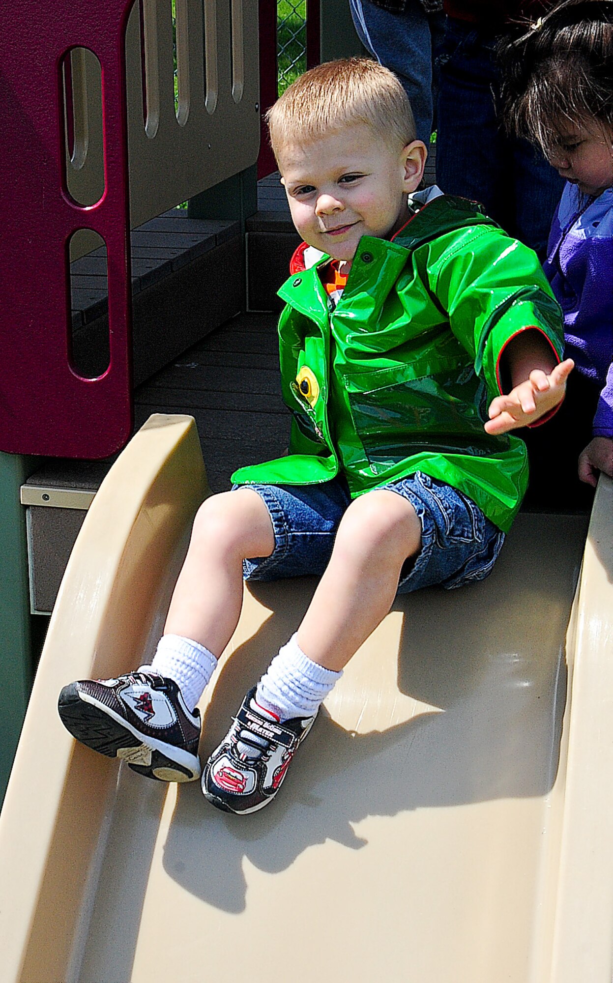 Jagges Clifford slides on the playground May 13, 2013, at the Child Development Center on Dover Air Force Base, Del. The CDC has six playgrounds on which the children can play. (U.S. Air Force photo/Airman 1st Class Ashlin Federick)