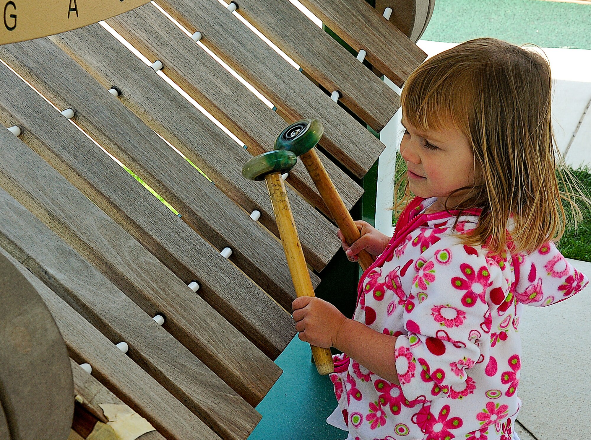 Harley Daniels plays with a glockenspiel May 13, 2013, at the Child Development Center on Dover Air Force Base, Del. The CDC is a place for children to grow and develop all their skills. (U.S. Air Force photo/Airman 1st Class Ashlin Federick)