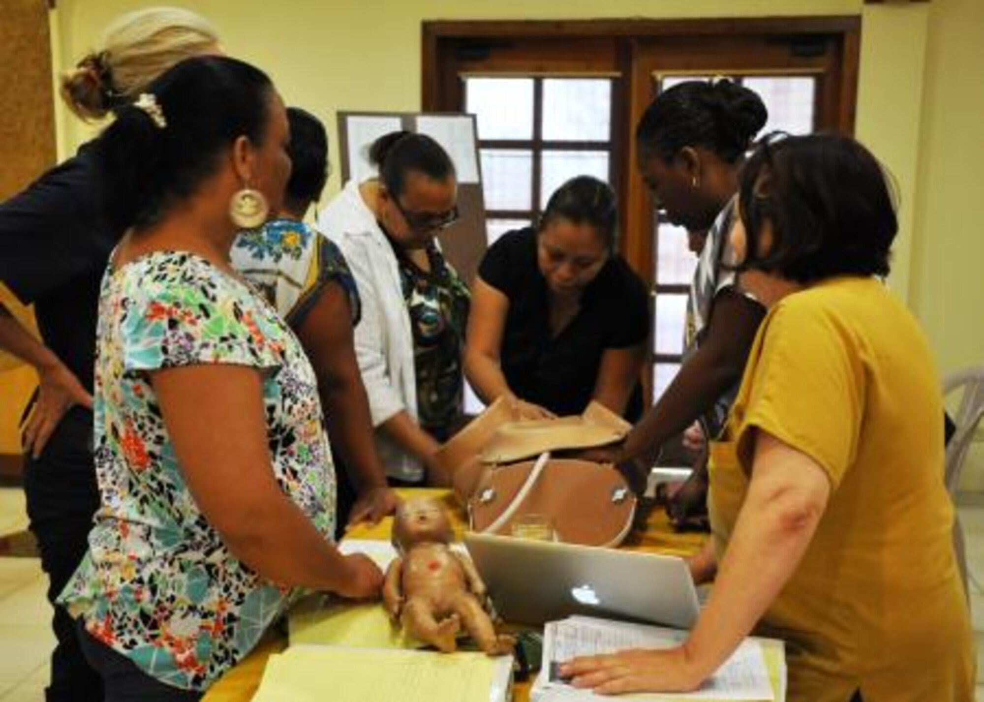 Project HOPE volunteers and Belizean doctors, nurses and midwives practice how to respond to different obstetric emergencies May 22, 2013 in Dangriga, Belize. Obstetrics is a medical specialty concerning the care of women during pregnancy, childbirth and the period following delivery. U.S. Air Force, Project HOPE and Belizean health care professionals partnered together to establish a two-day Advanced Life Support in Obstetrics exchange as part of an exercise called New Horizons. New Horizons is a U.S. Southern Command exercise that gives U.S., Canadian and Belizean personnel an opportunity to train jointly in an exercise setting in order to be prepared to meet future challenges. Personnel are providing medical and dental care, as well as constructing educational buildings throughout Belize as part of the training. (U.S. Air Force Photo/Capt. Holly Hess)
