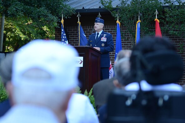 Maj. Gen. Lawrence Wells, 9th Air Force commander, speaks at the Vietnam Traveling Memorial Wall dedication ceremony at Swan Lake Iris Gardens, Sumter S.C., May 24, 2013. The traveling memorial wall is a three-fifths scale replica of the Vietnam Memorial in Washington, D.C. The wall stands as a reminder of the great sacrifices made during the Vietnam War. (U.S. Air Force photo by Airman 1st Class Daniel Blackwell/Released)