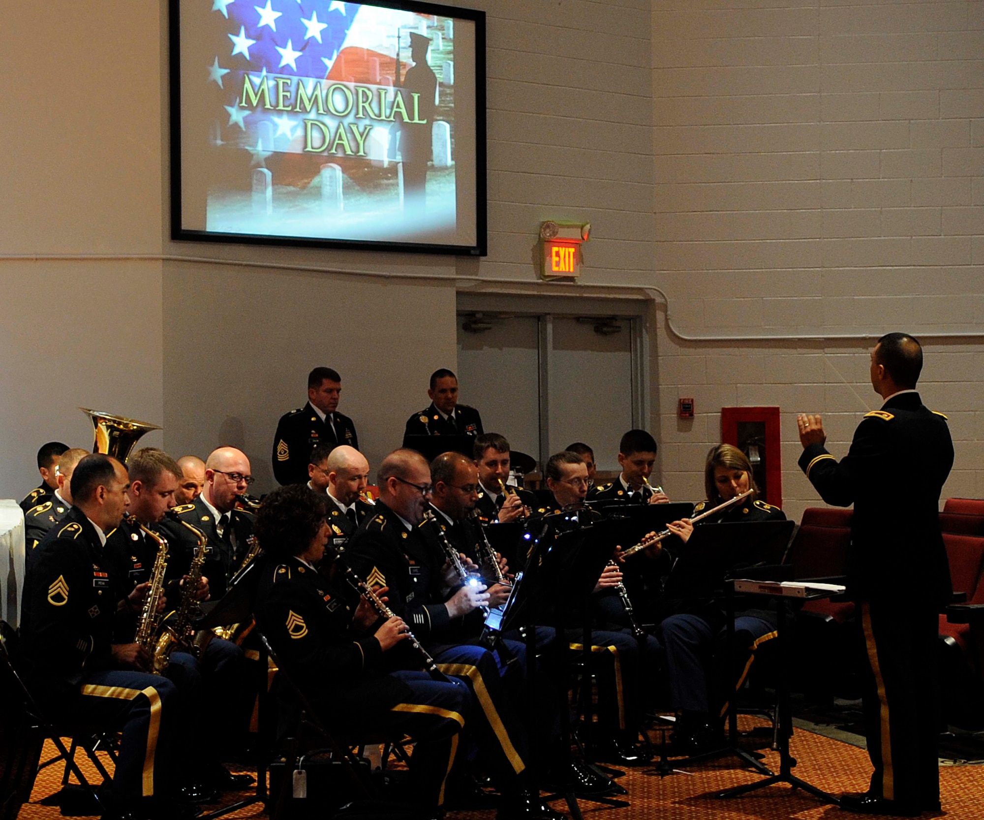 Soldiers from the U.S. Army Training and Doctrine Command Band perform “America the Beautiful” during the Memorial Day Ceremony at Jacobs Theater at Fort Eustis, Va., May 23, 2013. The ceremony included a guest speaker, a performance by the U.S. Army Training and Doctrine Command Band and a 21-gun salute in honor of fallen U.S. Service members. (U.S. Air Force photo by Staff Sgt. Dana Hill/Released)