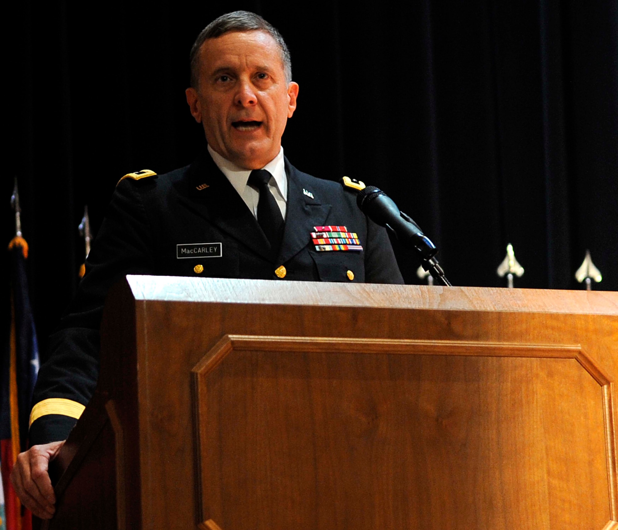 U.S. Army Maj. Gen. Mark MacCarley, U.S. Army Training and Doctrine Command deputy chief of staff, addresses the audience during the Memorial Day Ceremony at Jacobs Theater at Fort Eustis, Va., May 23, 2013. MacCarley served as guest speaker, providing significant facts about Memorial Day and helping pay tribute to fallen U.S. Service members. (U.S. Air Force photo by Staff Sgt. Dana Hill/Released)