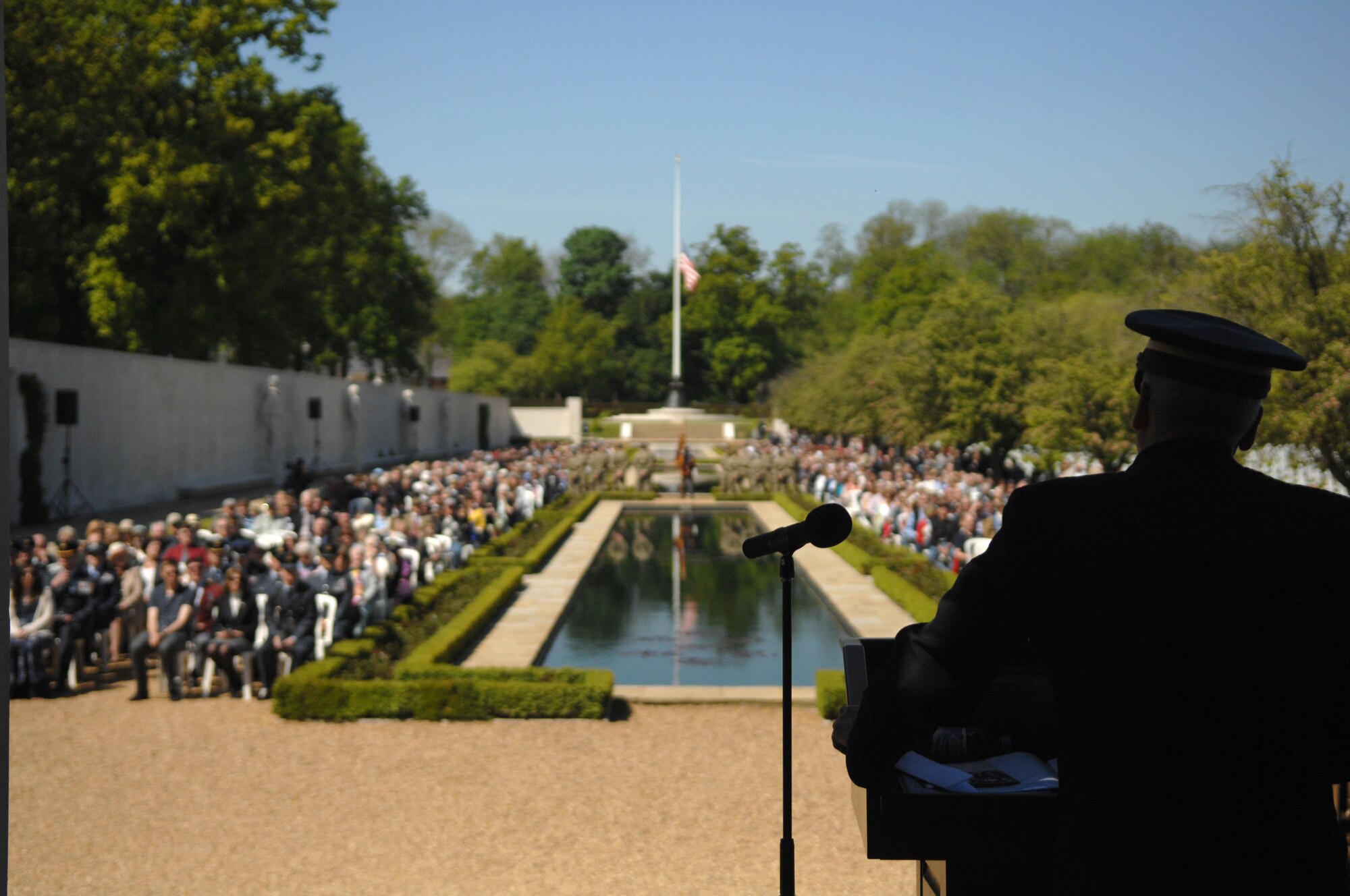 Michael Green, Madingley American Cemetery superintendent, speaks to Memorial Day ceremony attendees May 27, 2013, at the Madingley American Cemetery in Cambridge, England. After 16 years serving as superintendent, this was Green’s final Memorial Day ceremony at the Cemetery. (U.S. Air Force photo by Airman 1st Class Dillon Johnston/Released)