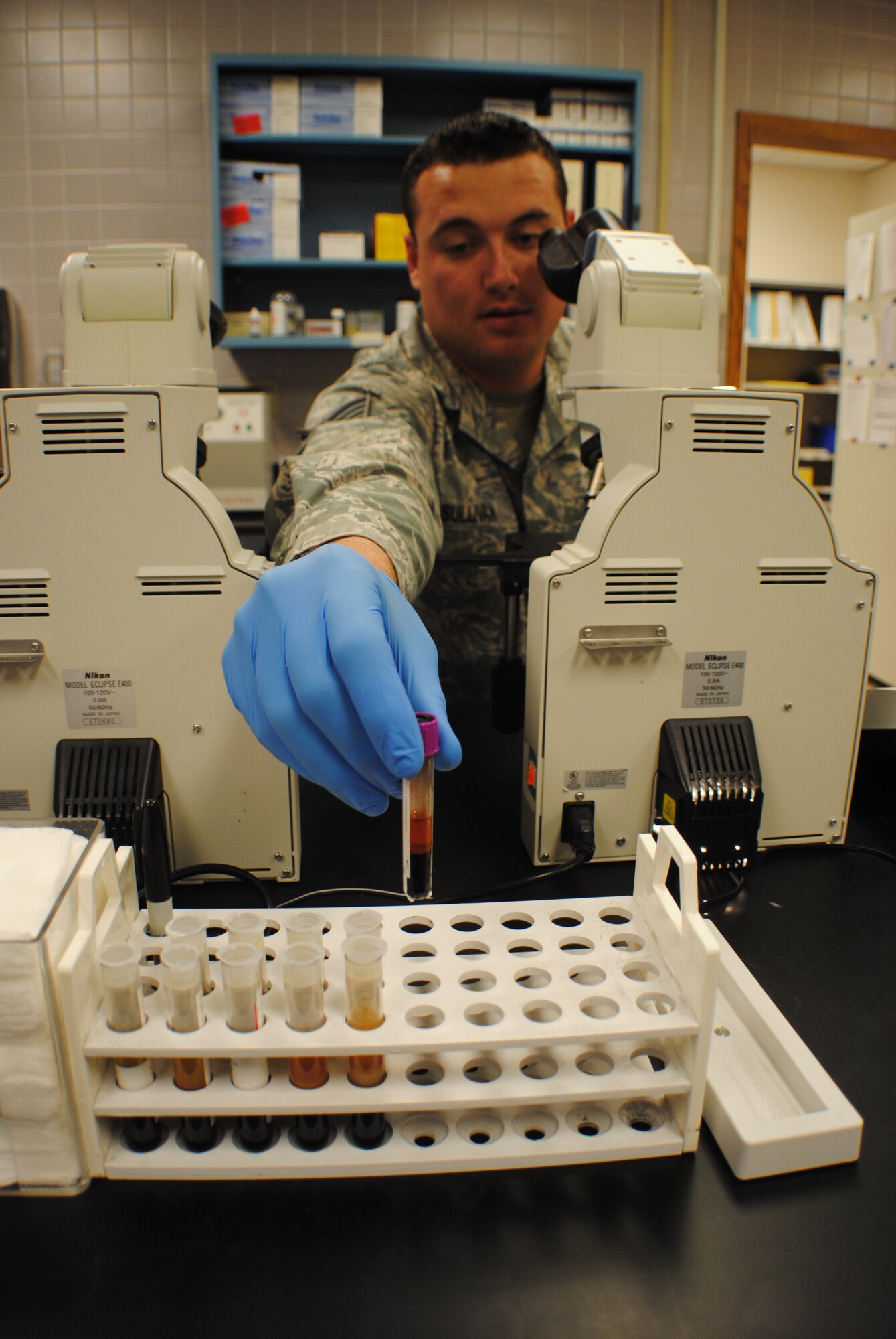 Staff Sgt. Thomas C. Sullivan Jr., 319th Medical Support Squadron laboratory technician, carefully places a medical sample back into a test tube rack May 22, 2013, at the medical laboratory on Grand Forks Air Force Base, N.D. The base medical laboratory processed about 20,000 patient samples in 2012. (U.S. Air Force photo/Staff Sgt. Luis Loza Gutierrez)
