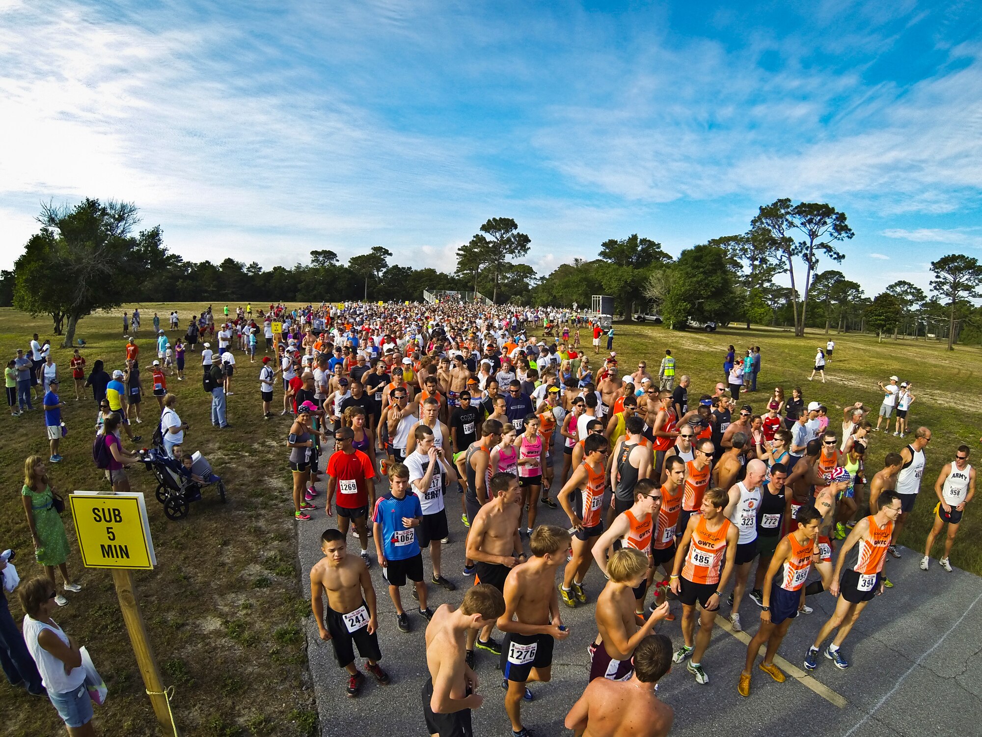 More than 1,500 runners ready for the start of the 28th annual Gate-to-Gate Run May 27 at Eglin Air Force Base, Fla.  Many of the runners paid their respects by dropping off flowers in front of the All Wars Memorial as they raced by.  (U.S. Air Force photo/Samuel King Jr.)