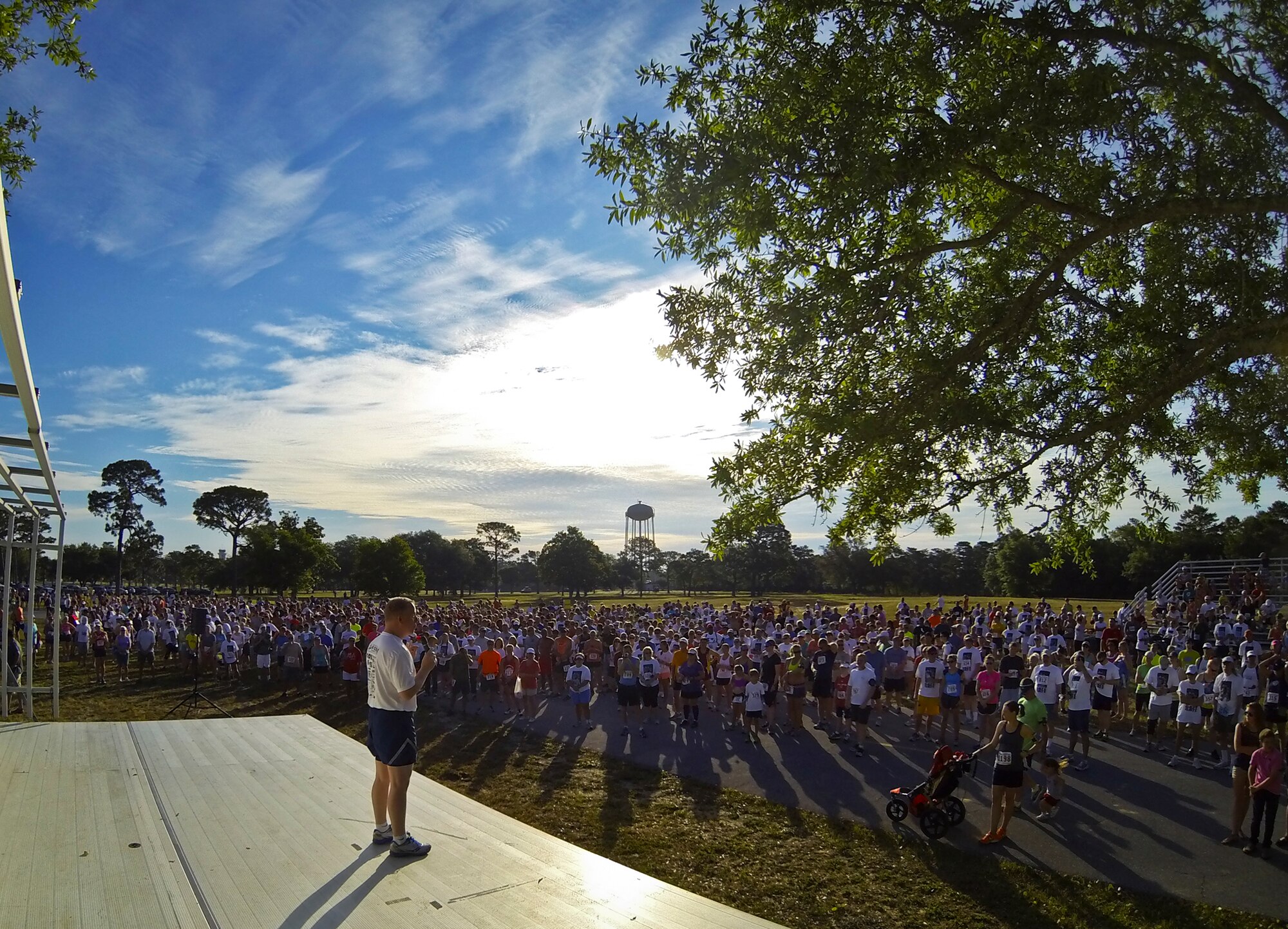 Brig. Gen. David Harris, the 96th Test Wing commander, addresses the large crowd of runners prior to the 28th annual Gate-to-Gate Run May 27 at Eglin Air Force Base, Fla. More than 1,500 people participated in the Memorial Day race.  Many of the runners paid their respects by dropping off flowers in front of the All Wars Memorial as they raced by.  (U.S. Air Force photo/Samuel King Jr.)
