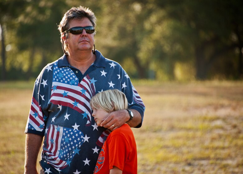 Many patriotic Americans came out to watch and participate in the 28th annual Gate to Gate Run May 27 at Eglin Air Force Base, Fla.  More than 1,500 people participated in the Memorial Day race.  Many of the runners paid their respects by dropping off flowers in front of the All Wars Memorial as they raced by.  (U.S. Air Force photo/Samuel King Jr.)