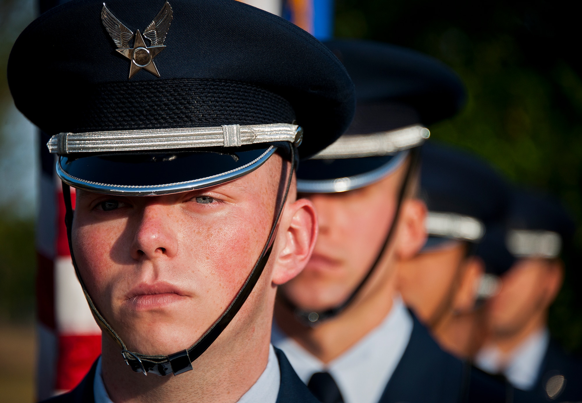 Senior Airman Arlo Brownlee and the Eglin Honor Guard stands ready to bring in the colors prior to the 28th annual Gate to Gate Run May 27 at Eglin Air Force Base, Fla.  More than 1,500 people participated in the Memorial Day race.  Many of the runners paid their respects by dropping off flowers in front of the All Wars Memorial as they raced by.  (U.S. Air Force photo/Samuel King Jr.)