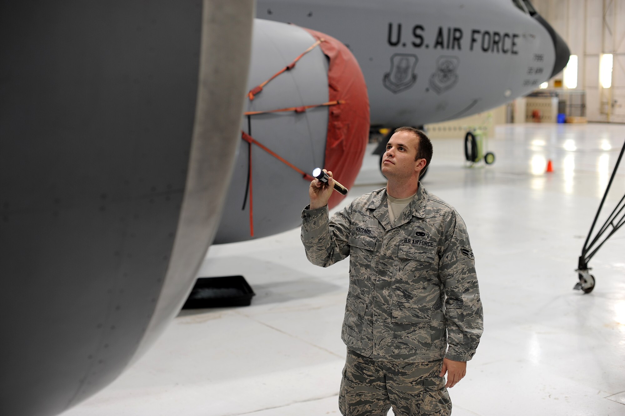 Airman 1st Class Dean Haggard, 22nd Aircraft Maintenance Squadron maintenance journeyman, inspects a KC-135 Stratotanker engine May 22, 2013, McConnell Air Force Base, Kan. As a maintenance journeyman, Haggard's responsibilities include the daily inspections and maintenance of the KC-135s assigned to McConnell AFB. Haggard was selected as the spotlight performer of the week of May 20 to 24. (U.S. Air Force photo/Airman 1st Class Jose L. Leon)