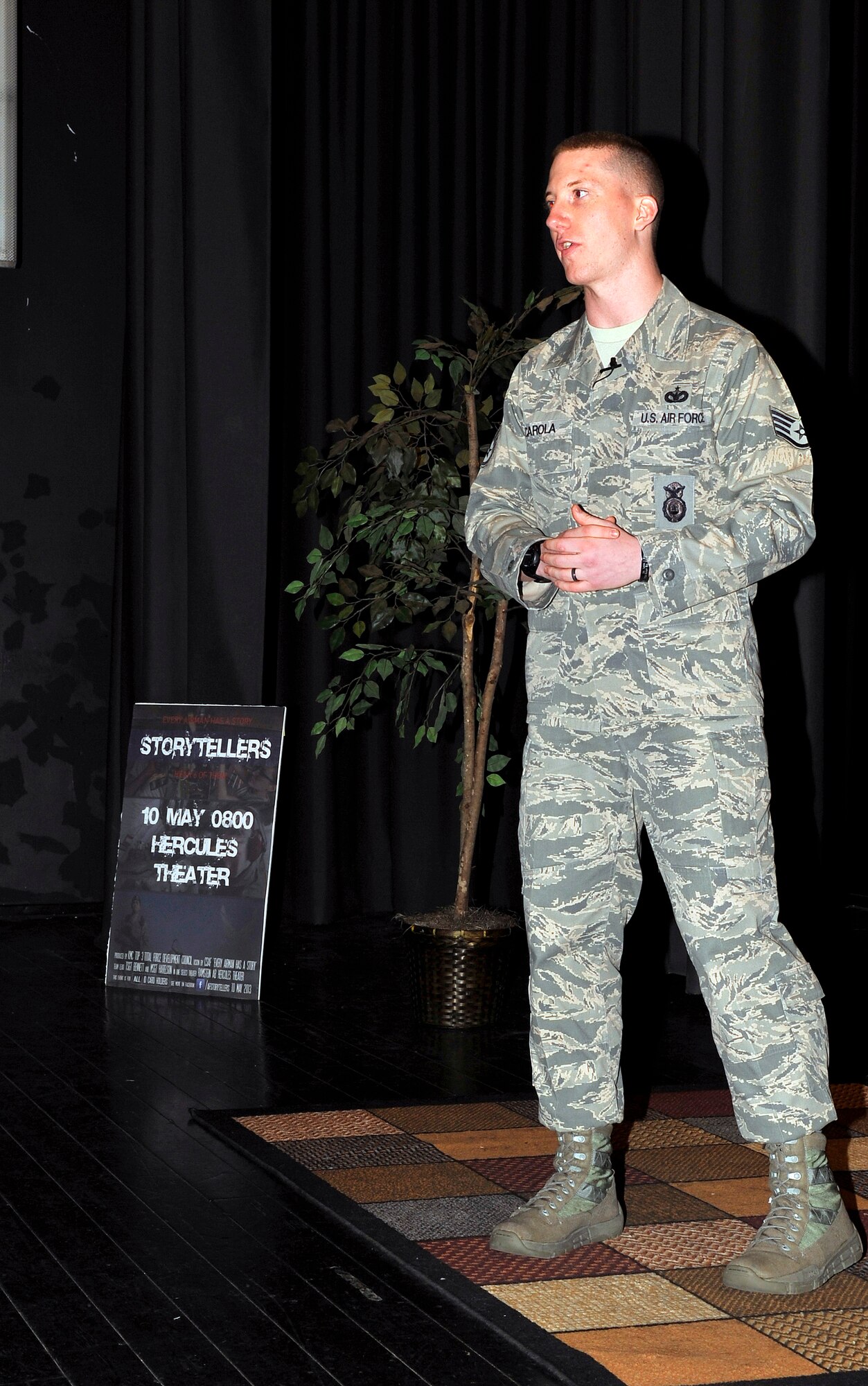 Staff Sgt. Daniel Scarola, 435th Security Forces Squadron unit deployment manager, shares his story at the storytellers event, May 10, 2013, Ramstein Air Base, Germany. Scarola spoke about dealing with deployments and losing friends and family. The storytellers event gave Airmen the opportunity to come together and share their stories. (U.S. Air Force photo/Airman 1st Class Trevor Rhynes)