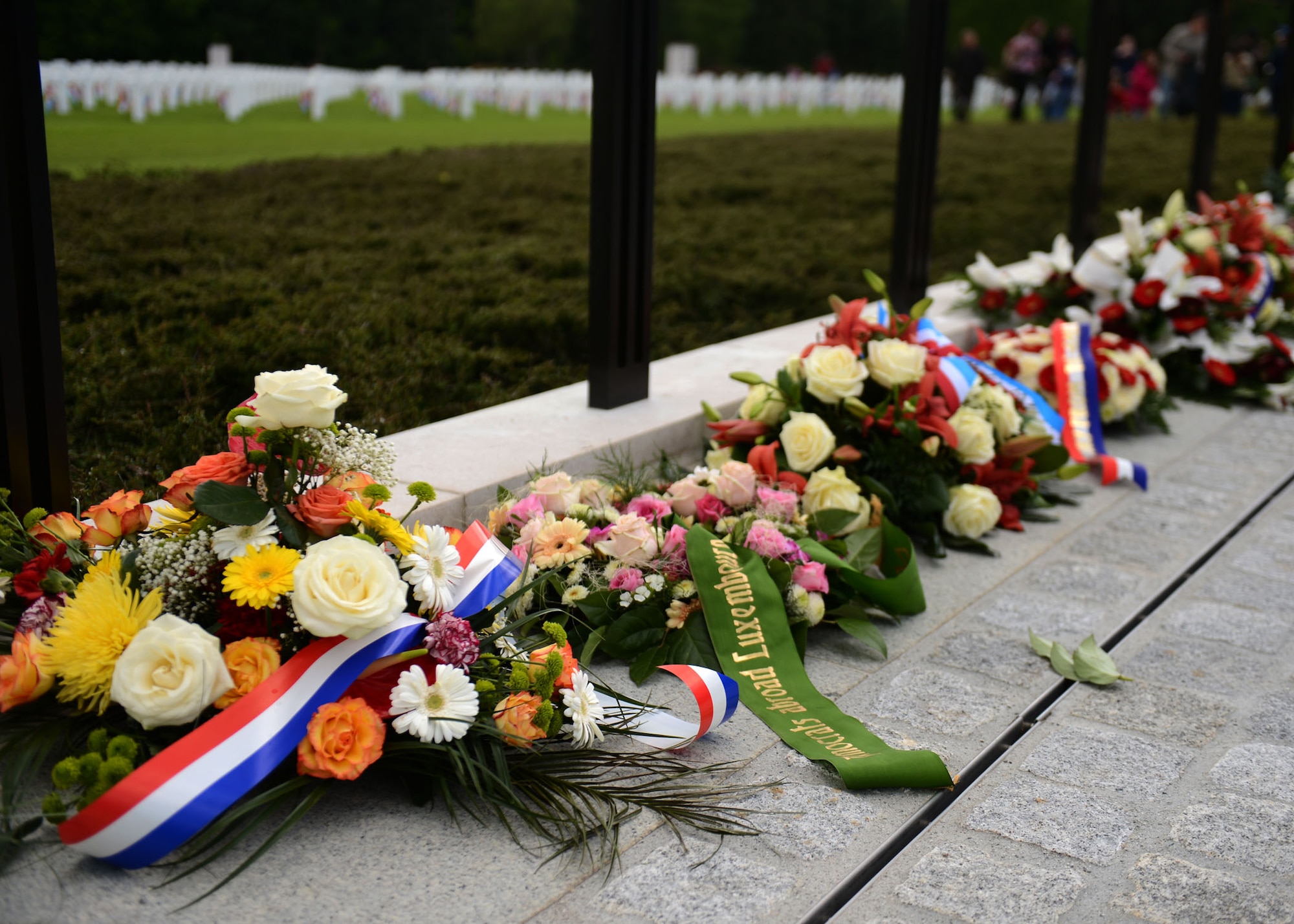 LUXEMBOURG CITY, LUXEMBOURG – Memorial wreaths sit in a line during a Memorial Day commemoration at the Luxembourg American Military Cemetery and Memorial May 25, 2013. Friends and families of loved ones laid flowers in remembrance of the soldiers who died during World War II. (U.S. Air Force photo by Airman 1st Class Gustavo Castillo/Released)