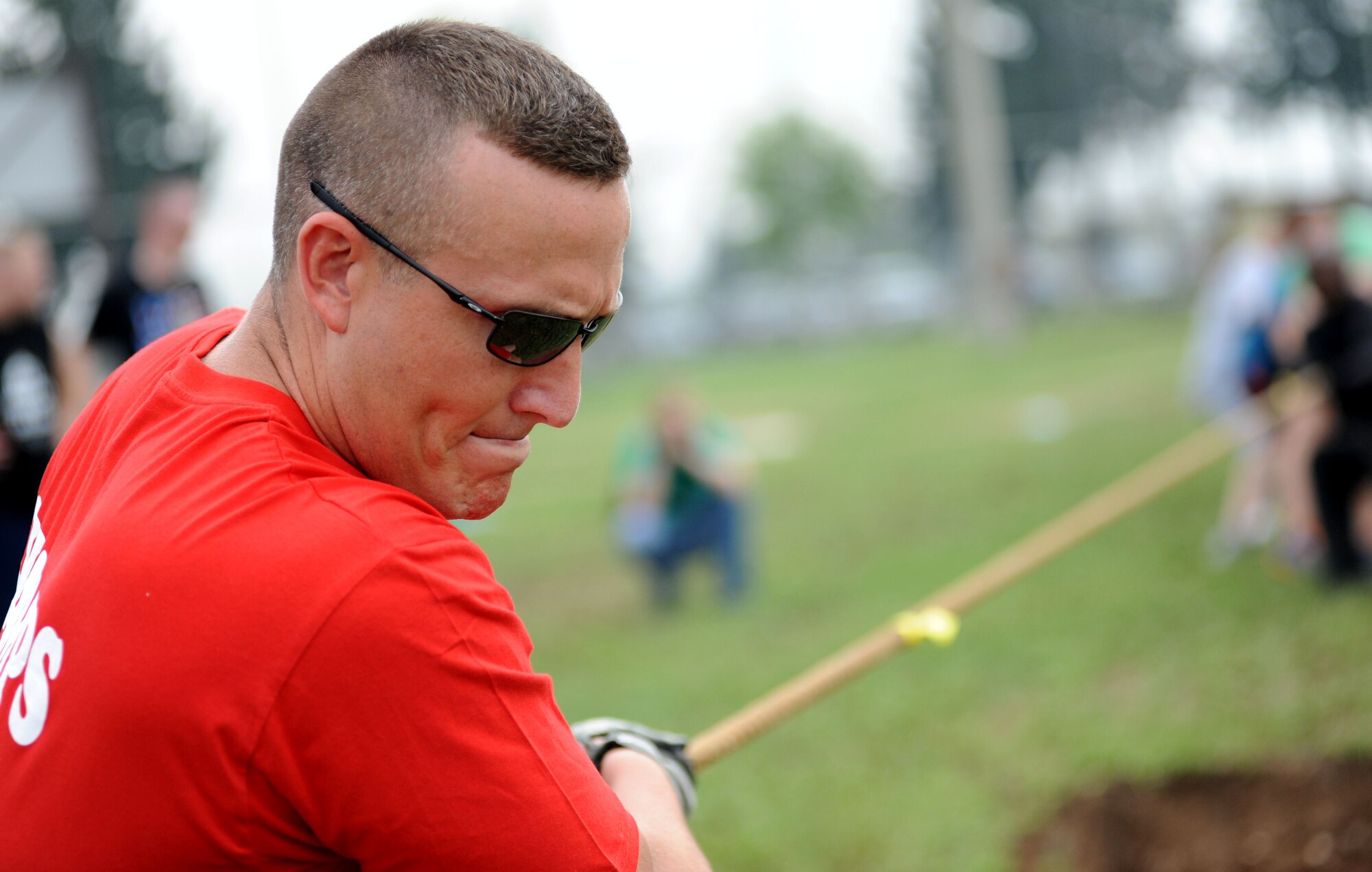Beau Parker, 39th Logistics Readiness Squadron tugs the rope during the 39th Air Base Wing Sports Day tug-of-war event May 24, 2013, at Incirlik Air Base, Turkey. Sports day was an event that brought Airmen together through sports and recreation. Airmen from several squadrons competed in friendly games of volleyball, softball, basketball, kickball, dodgeball and tug-of-war. (U.S. Air Force photo by Senior Airman Jarvie Z. Wallace/Released)