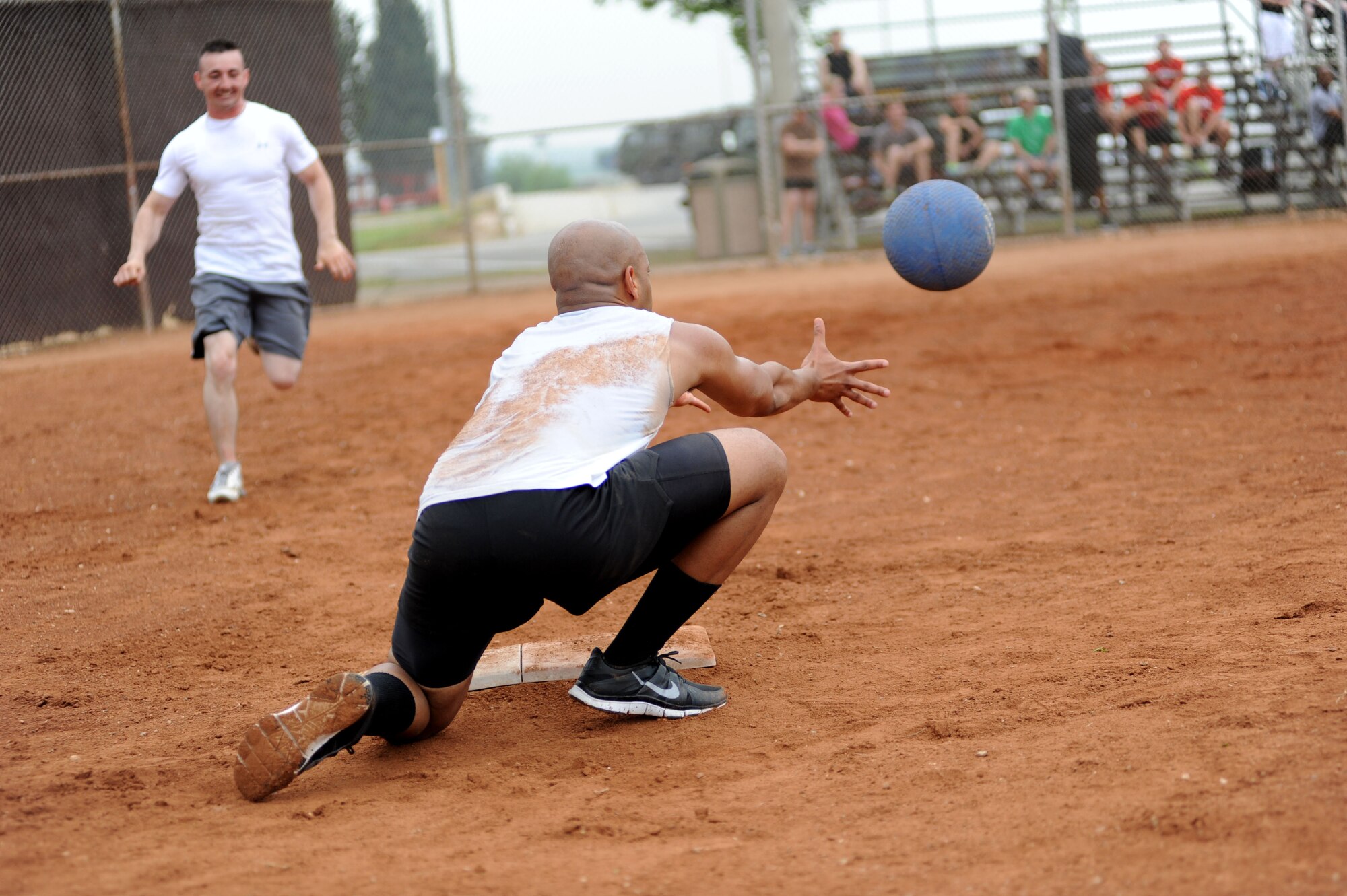 Trevor Jones, AFN Incirlik, outs a base runner in a game of kickball during the 39th Air Base Wing Sports Day May 24, 2013, at Incirlik Air Base, Turkey. Sports day consisted of Incirlik Airmen competing in 10 different sporting events ranging from dodgeball and kickball to corn hole toss and golf. (U.S. Air Force photo by Senior Airman Jarvie Z. Wallace/Released) 