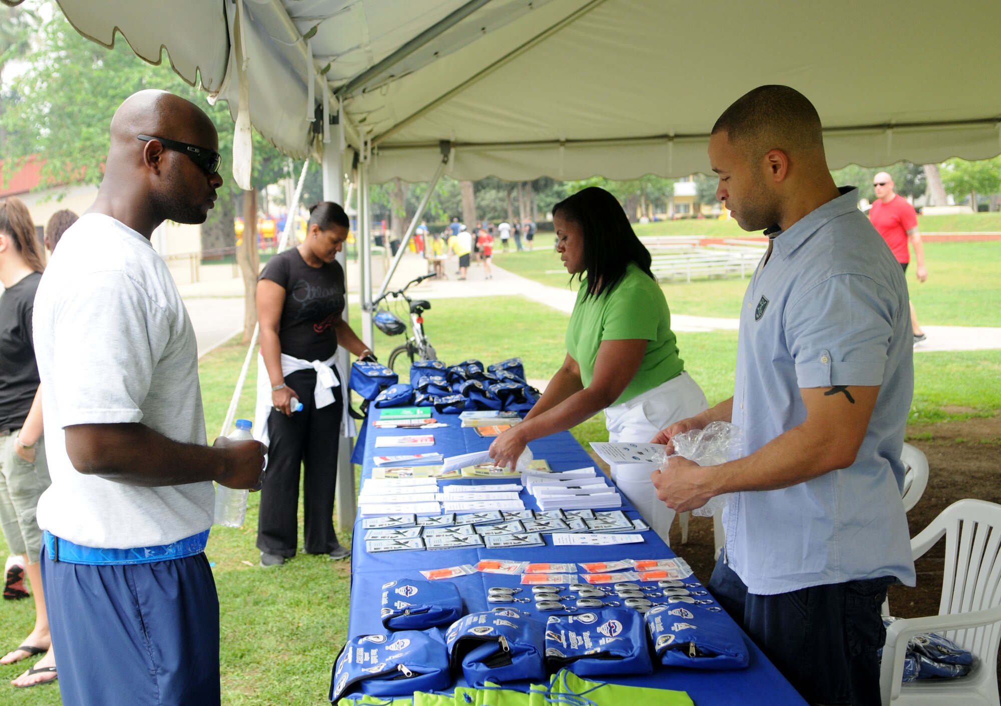 Members provide resiliency support information during the 39th Air Base Wing Sports Day May 24, 2013, at Incirlik Air Base, Turkey. The 39th Air Base Wing Sports Day was designed to build teamwork and camaraderie among different work sections by competing in various sporting events for the commander's trophy. (U.S. Air Force photo by Senior Airman Jarvie Z. Wallace/Released)  
