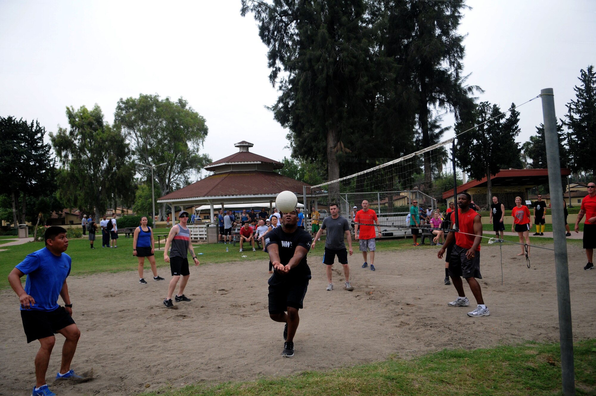Participants compete in a game of sand volleyball during the 39th Air Base Wing Sports Day May 24, 2013, at Incirlik Air Base, Turkey. The 39th Air Base Wing Sports Day was designed to build teamwork and camaraderie among different work sections by competing in various sporting events for the commander's trophy. (U.S. Air Force photo by Senior Airman Jarvie Z. Wallace/Released)  