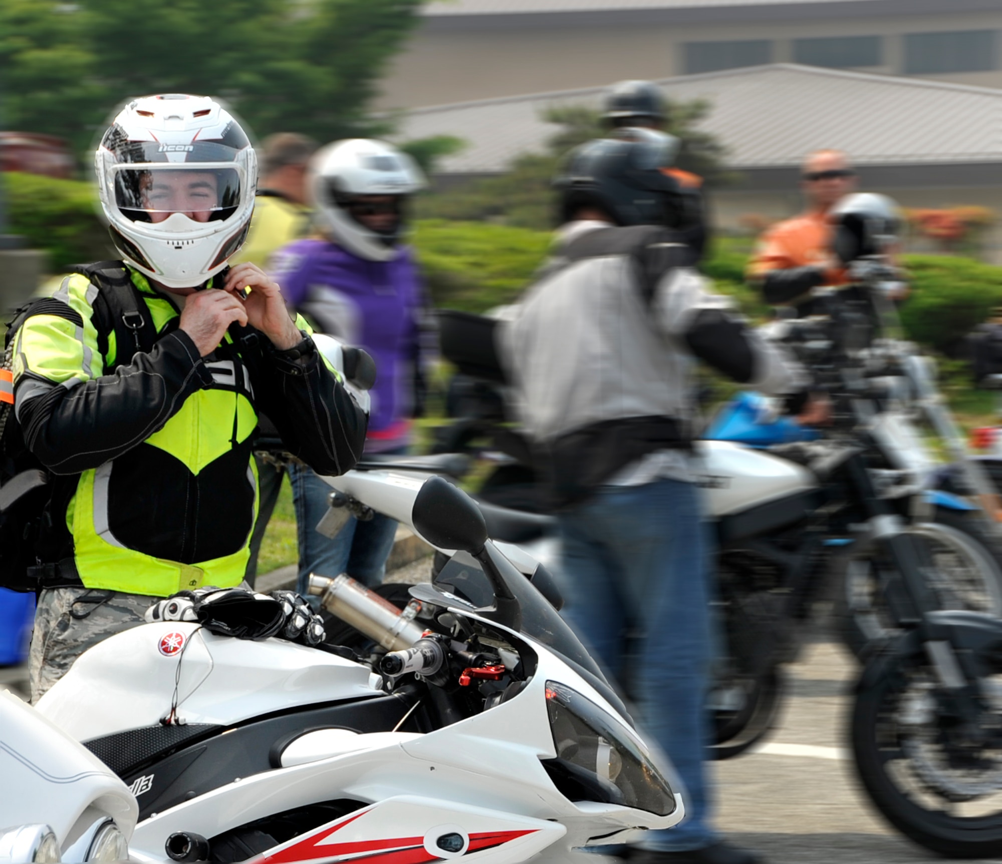 Staff Sgt. Carroll Pellegrin, 51st Maintenance Operations Squadron ammunitions storage crew chief, straps on his helmet before a group ride during the 101 Critical Days of Summer kick-off May 23, 2013. The campaign will continue through Sept. 3, giving Airmen useful tips, statistics and information to assist them in staying safe and fit to fight during the warmer months. (U.S. Air Force graphic/Senior Airman Kristina Overton)