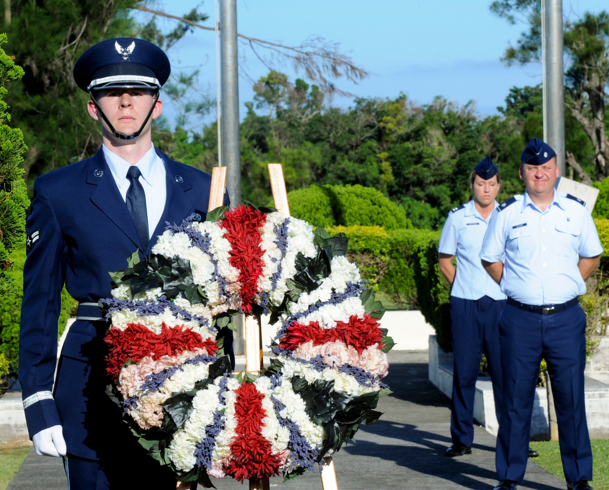 U.S. Air Force Airman 1st Class Kevin Greer, Kadena Honor Guard member, stands at attention next to the wreath during the Memorial Day ceremony on Kadena Air Base, Japan, May 27, 2013. Memorial Day is a day of remembrance for the men and women who died while serving their country. (U.S. Air Force photo by Airman 1st Class Justin Veazie/Released)