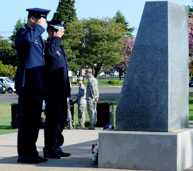 At Risner Circle a Memorial Day Retreat Ceremony was held at Misawa Air Base, Japan, May 23, 2013. During the ceremony, in honor of those who gave up everything for their people, the wing commander, Col. Williams, left, and 3rd Air Wing commander, Maj. Gen. Kidono, laid a commemorative wreath at the base of the memorial stone, where the names of those who’ve died in battle are engraved. (U.S. Air Force photo by Airman 1st. Class Kenna Jackson) 