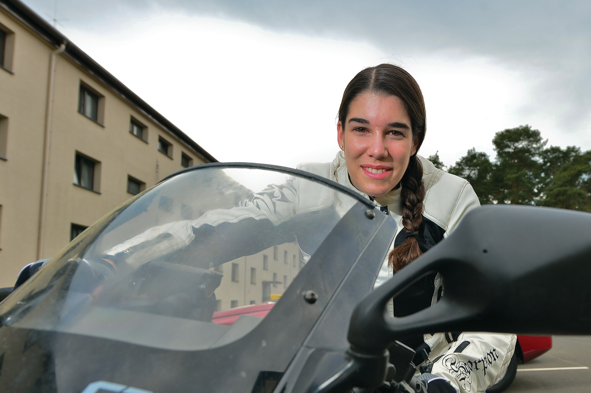 Airman 1st Class Alanna Britton, 86th Airlift Wing military justice paralegal, parks her motorcycle on Ramstein Air Base, Germany, May 8, 2013. Britton has been riding motorcycles since high school. (U.S. Air Force photo/Airman 1st Class Jordan Castelan)