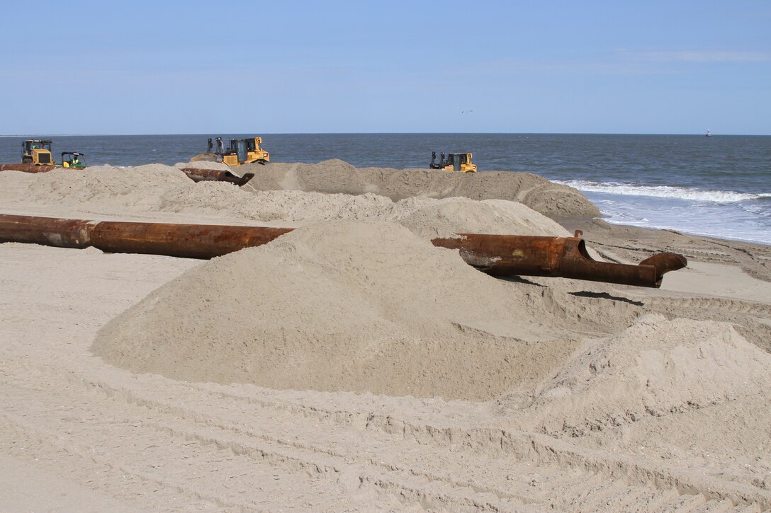 WALLOPS ISLAND, Va. – Pipes strewn along the newly built beach at NASA’s Wallops Island Flight Facility here carry sand pumped from dredges offshore. The new beach will help protect more than $1 billion in federal government and Commonwealth of Virginia assets located here.  The Wallops Island facility is home to, not only NASA, but also the US Navy Surface Combat Systems Center and the Mid-Atlantic Regional Spaceport making this a growing economic generator for the Commonwealth of Virginia and the region. 