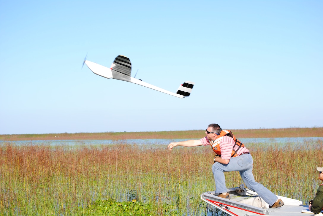 With a mighty heave, Damon Wolfe, geodesist with Jacksonville District, launches the NOVA Unmanned Arial Vehicle (UAV) on a flight over Lake Okeechobee.  The Corps used photos from the UAV to track the progress of various plant species at the lake. 