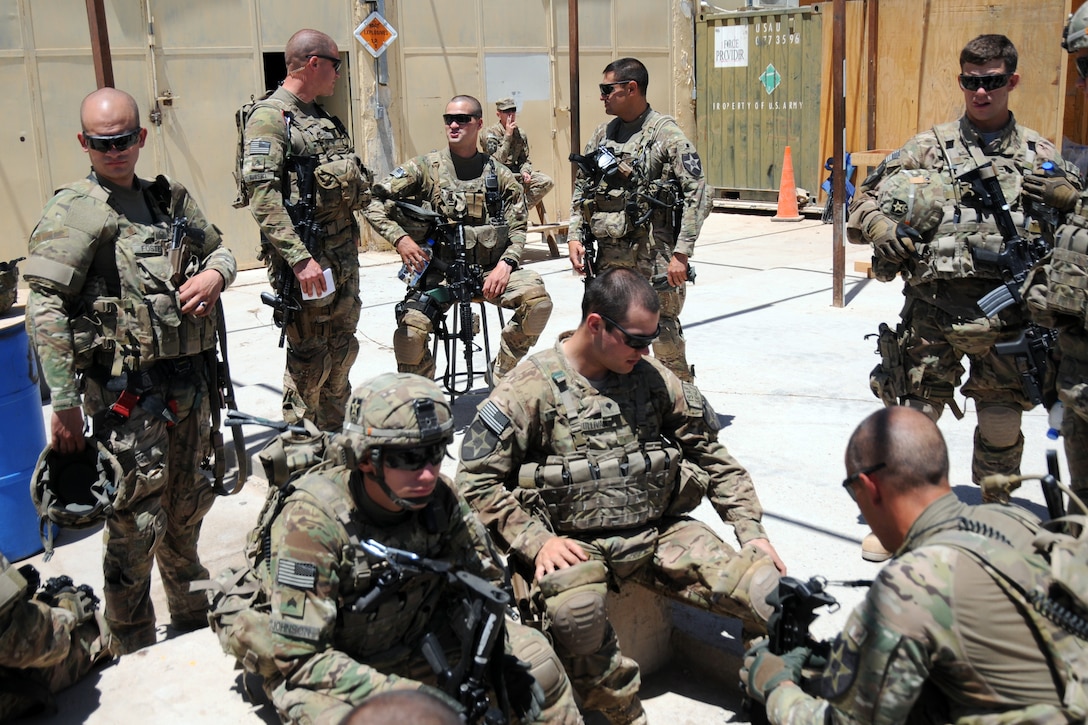 U.S. troops stand by for a pre-mission brief on Forward Operating Base ...