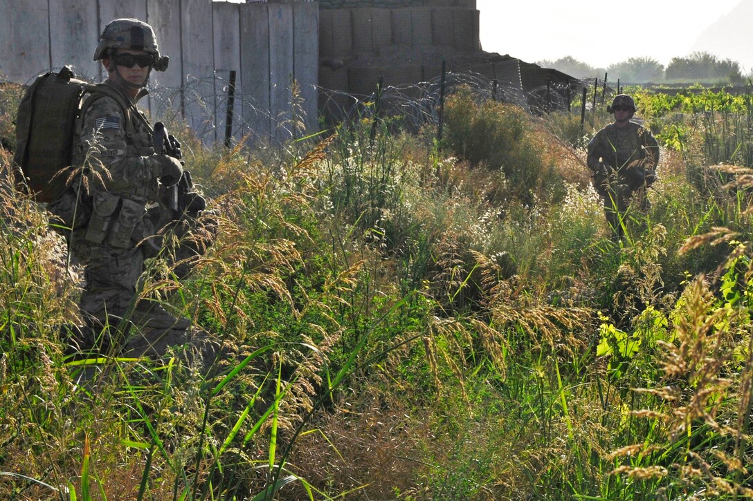U.S. soldiers provide security during a base defense patrol around Forward Operating Base Zangabad in Panjwai district in Afghanistan’s Kandahar province, May 23, 2013.