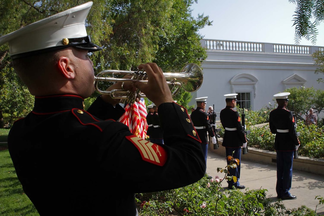 Sergeant John T. Finch, a trumpet player serving with the 1st Marine Division Band, plays taps to honor those who fought and died during the Vietnam War at the Richard Nixon Presidential Library and Museum for the Vietnam Prisoner of War 40th Annual Homecoming Reunion here, May 23, 2013. Nearly 200 former Vietnam POWs and their families gathered at the Nixon Presidential Library on the 40th anniversary of when President Nixon hosted the service members for the largest dinner ever held at the White House, May 24, 1973, on the South Lawn. A seven-man rifle detail and color guard from 1st Reconnaissance Battalion also supported the event.
