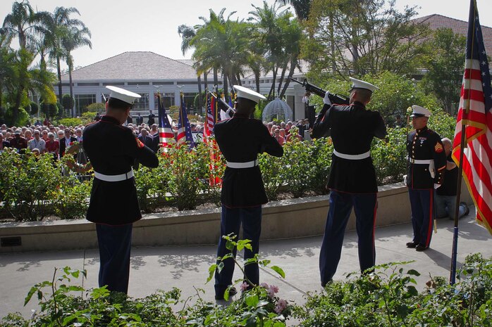 A seven-man rifle detail from 1st Reconnaissance Battalion honor those who fought and died during the Vietnam War with a 21-gun salute during the Vietnam Prisoner of War 40th Annual Homecoming Reunion at the Richard Nixon Presidential Library and Museum here, May 23, 2013. Nearly 200 former Vietnam POWs and their families gathered at the Nixon Presidential Library on the 40th anniversary of when President Nixon hosted the service members for the largest dinner ever held at the White House, May 24, 1973, on the South Lawn. The 1st Marine Division Band supported the reunion by playing ceremonial tunes for the event.