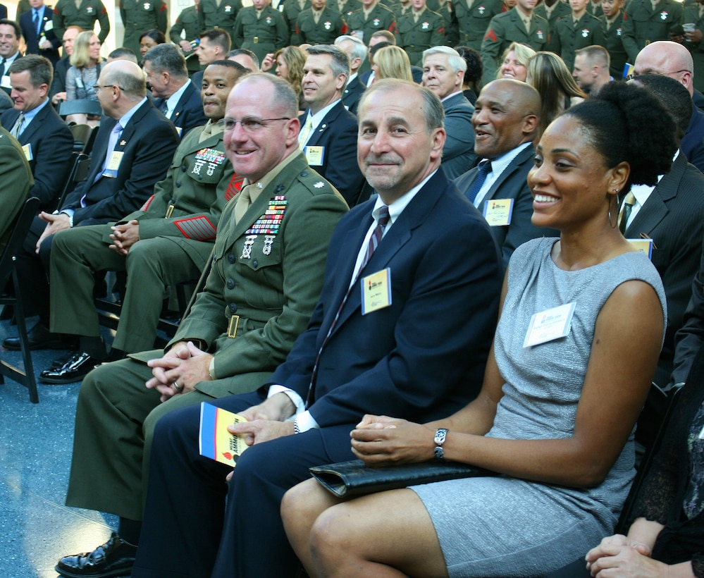 (Left to right) Lt. Col. Robert Emminger, deputy program manager for Ammunition at Marine Corps Systems Command; Jerry Mazza, program manager for Ammunition; and Gunnery Sgt. Tasha Johnson, staff noncommissioned officer in charge of the Inventory Management Team in PM Ammo, attend the 2012 Ammunition Awards Program Reception May 22 at the National Museum of the Marine Corps in Triangle, Va. The awards are named in honor of Johnson’s husband, Gunnery Sgt. Edwin Johnson, an ammunition technician who was killed in action in Afghanistan in 2009. 